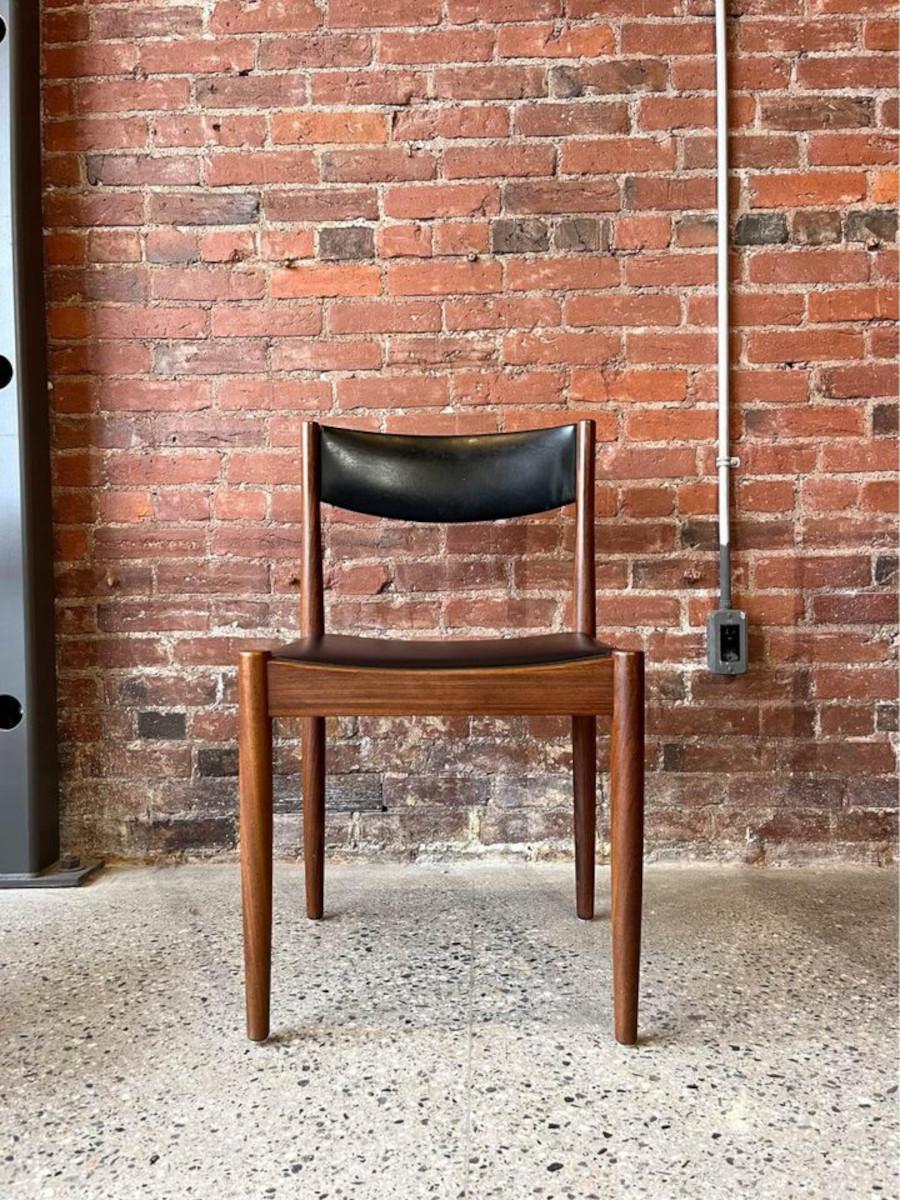 Enhance your dining area with the exquisite allure of these four Poul Volther for Frem Røjle dining chairs, each a masterpiece of mid-century Danish design. Crafted with meticulous attention to detail, they showcase Volther's iconic aesthetic,