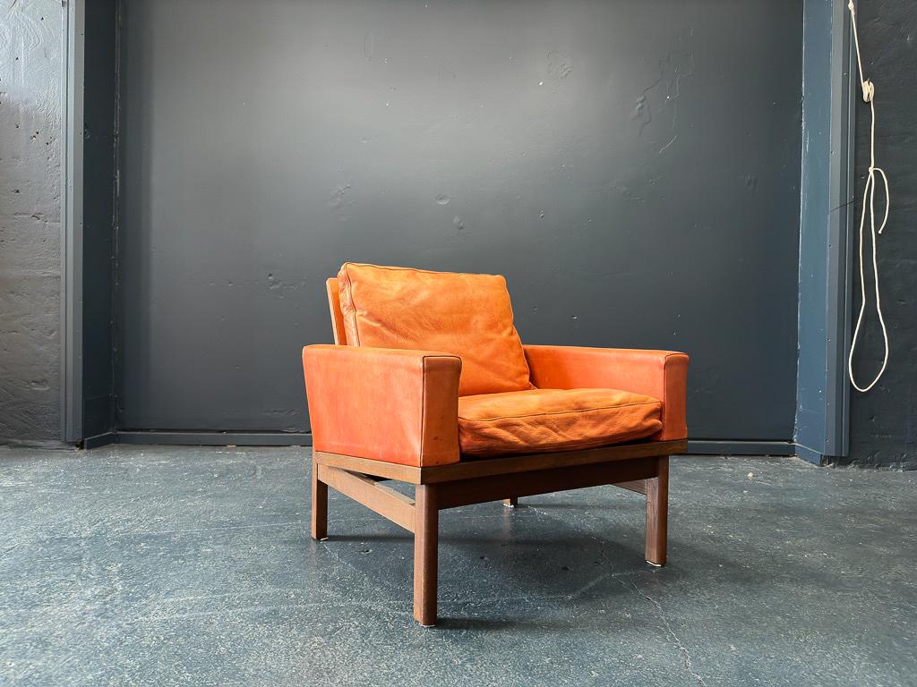 This incredible statement armchair was designed by Poul Volther and produced by manufacturer Erik Jørgensen in the early 1960s. This piece features a structural oak frame comprised of sharp angles and the use of single wooden elements to create