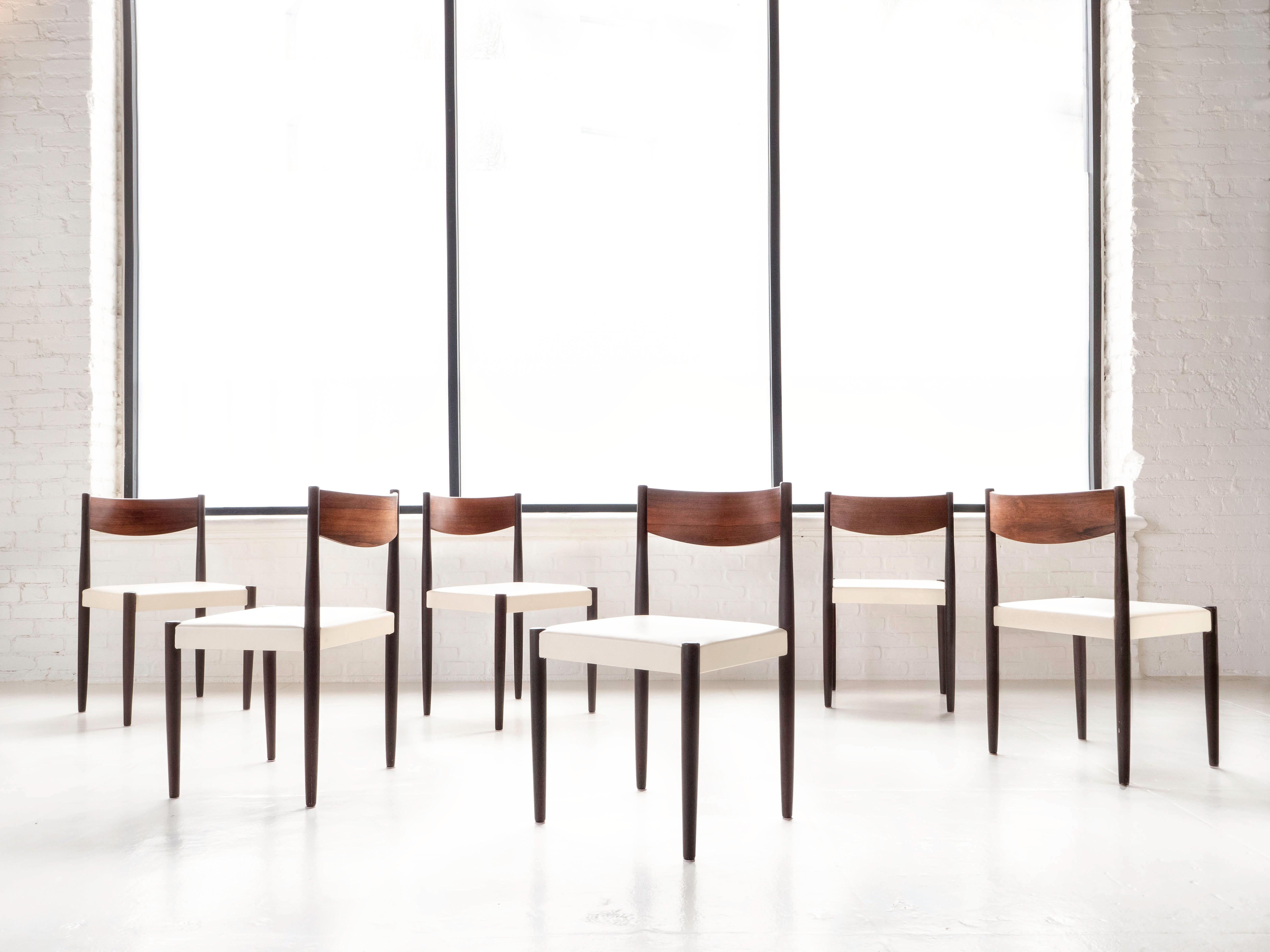 Set of 6 dining chairs by designer Poul Volther for Danish company Frem Røjle, circa 1960's. The chairs are dark stained with Brazilian rosewood backrests. Newly upholstered in creamy white toned Edelman leather hides. The chairs are in excellent
