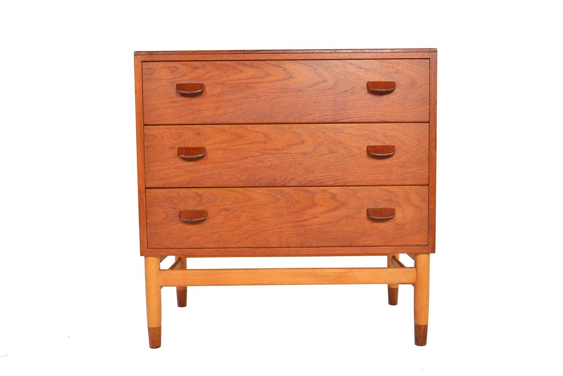 This gorgeous Danish modern three-drawer teak gentleman’s chest designed by Poul Volther is a rare find. Rich wood grain and high quality construction define this Classic piece. Each drawer features two teak flat pulls. Case stands on beech leg base