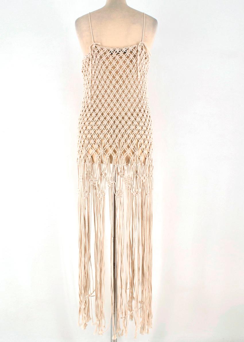 Poustovit Sand Crochet Dress

-Macrame weaving
-Straps
-Fringe
-Unlinned
-Professional dry cleaning

Materials 
100% Cotton 

Dry Clean Only 
Measurements are taken laying flat, seam to seam. 
Length: 115cm