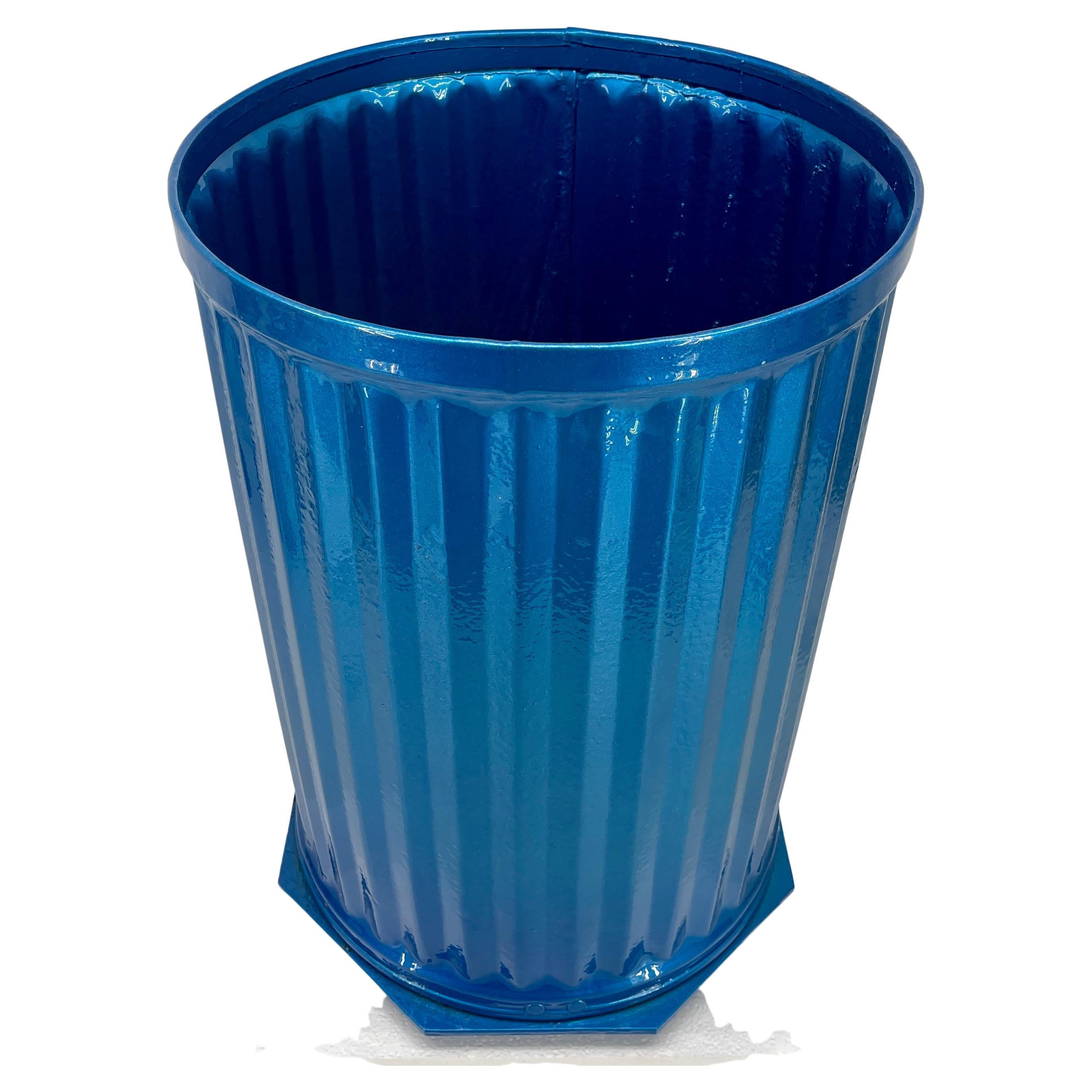 Industrial metal trash can, bin or umbrella stand.

We can offer these bins powder coated in any color at buyers request.

Freshly powder coated in bright Maui blue, this tall and sturdy bin has strong fluting detail all around and solid base.