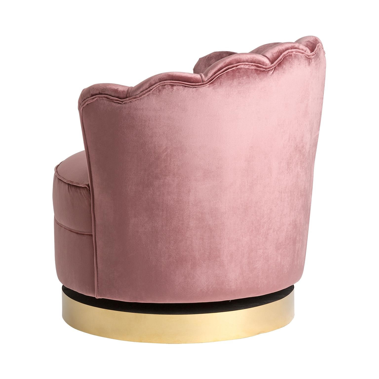 Golden round foot and powdery pink velvet swivel and lounge and comfy armchair in Art Deco style.