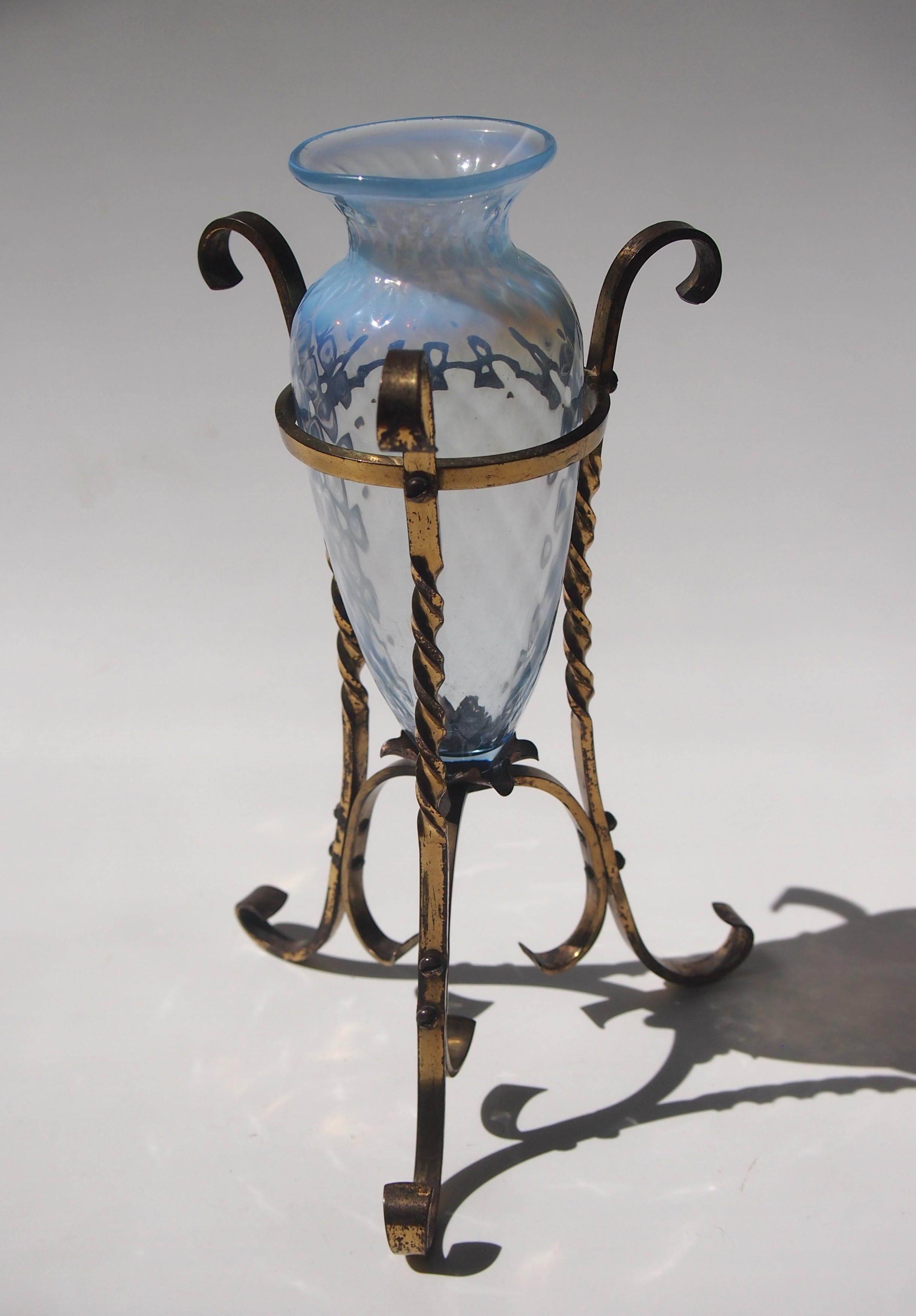 A superb Arts & Crafts blue opal urn glass vase by James Powell of London in a bronze and copper stand by W A S Benson circa 1888. The glass urn is decorated with a diamond pattern, The frame is almost all bronze with a small copper flower in the
