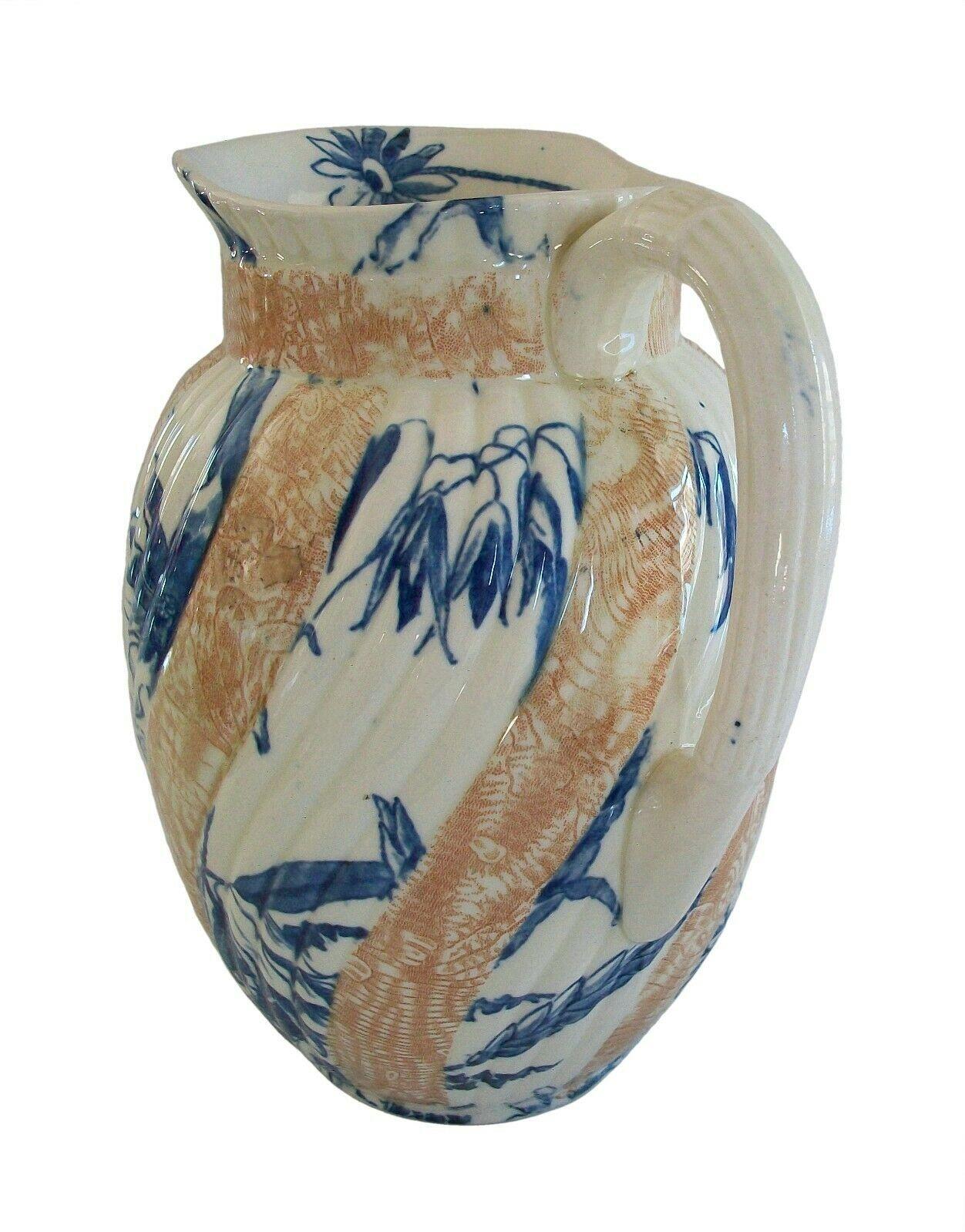 POWELL, BISHOP & STONIER (Manufacturer) - Beatrice No. 4 (Product Line) - Rare and exceptional Aesthetic Movement ceramic pitcher / vase - two color transfer decorated featuring ferns and flowers and leaves - blue transfer daisy to the spout -