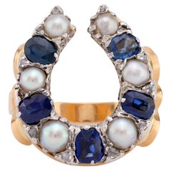 Potente antico anello a ferro di cavallo francese con zaffiro e perla e diamante in oro 18k
