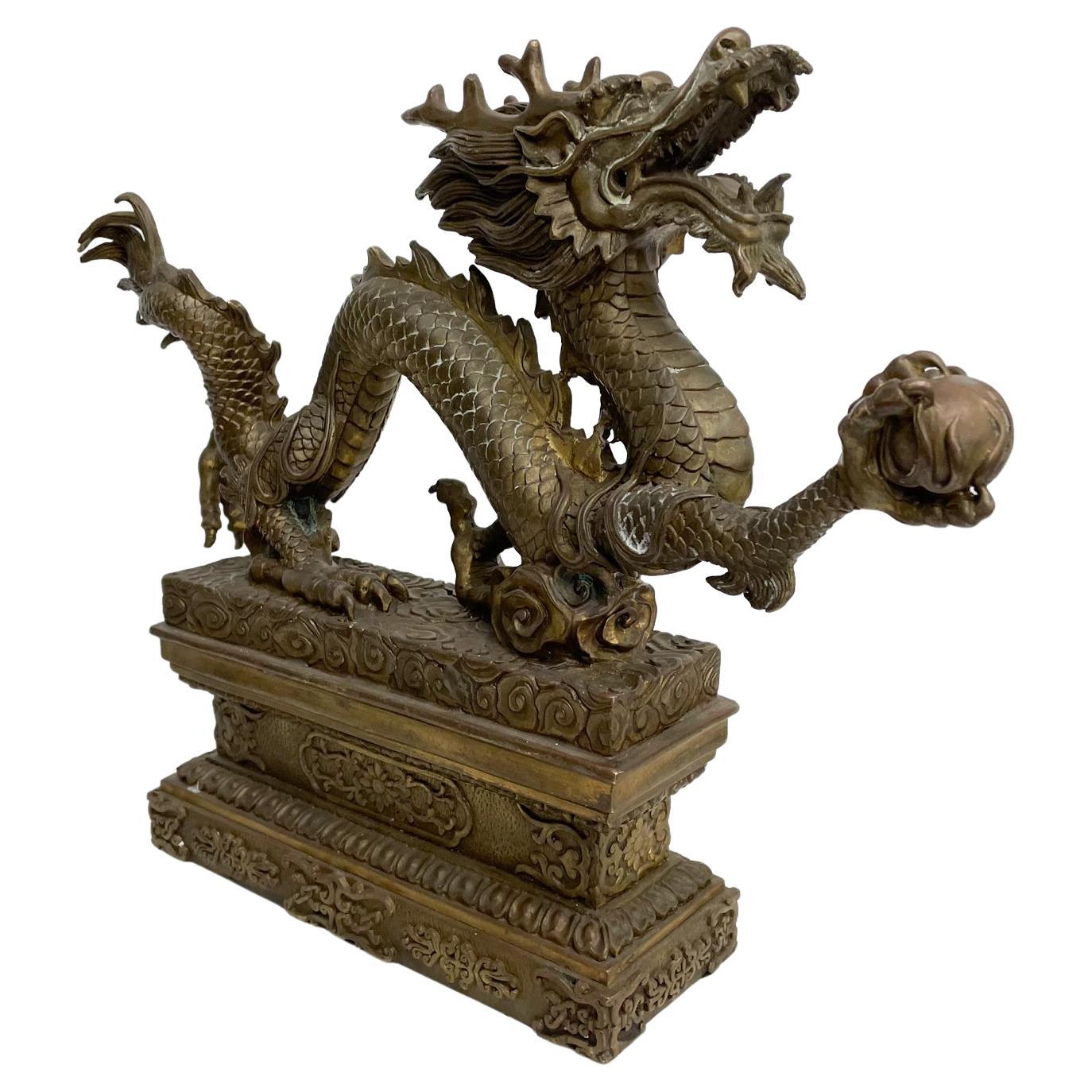 Chinese Dragon sculpture
Powerful Chinese Feng shui Dragon with Ball Bronze Sculpture Ornate Relief
Made in cast bronze sculpture of a Chinese Dragon holding a ball.
A must for the Feng Shui fanatics who believe in the power of the golden