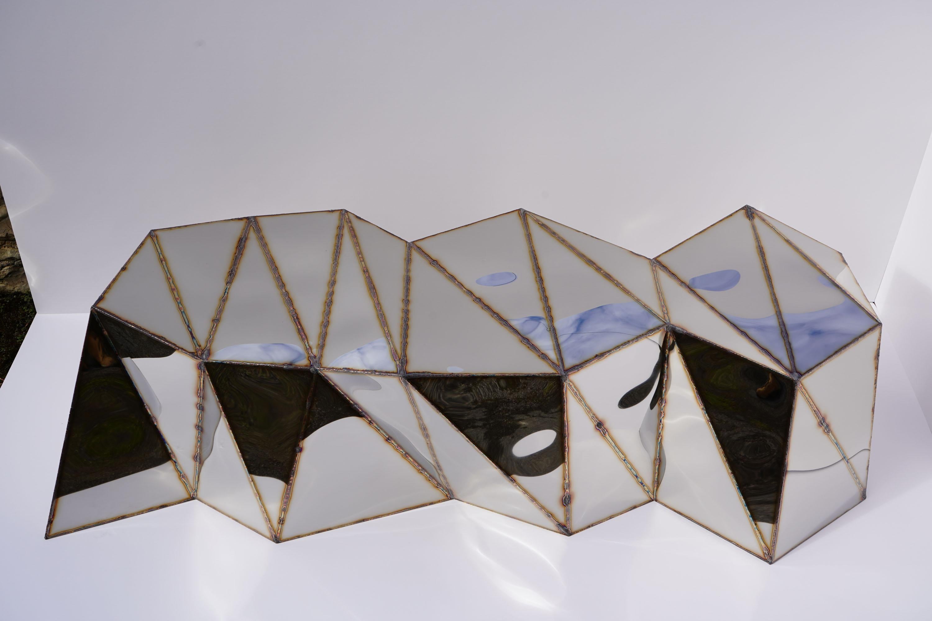 Powerlines Bench in Welded Mirror-Polished Stainless Steel by Julian Mayor
Limited Edition of 8 + 4AP.
Dimensions: D 72 x W 195 x H 50 cm. 
Materials: Mirror-polished stainless steel.

Julian Mayor is a British artist and designer renowned for his