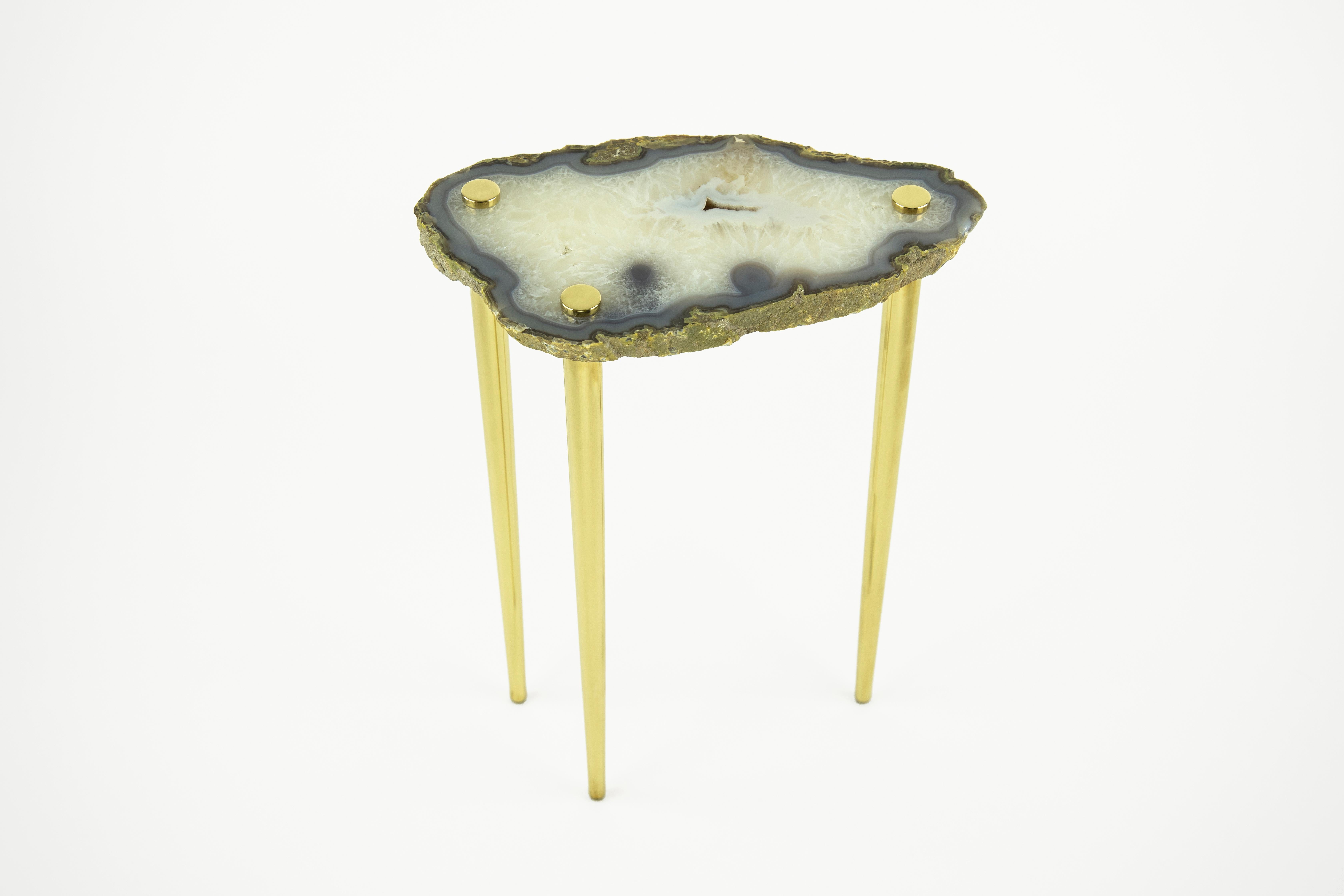 Zoom in and get lost in the beauty of these high-polished natural quartz crystal table tops pierced by solid brass legs. The 'Powers of 10' Tables are durable, heavy, and one-of-a-kind. Each one has a unique shape and other worldly color palette.