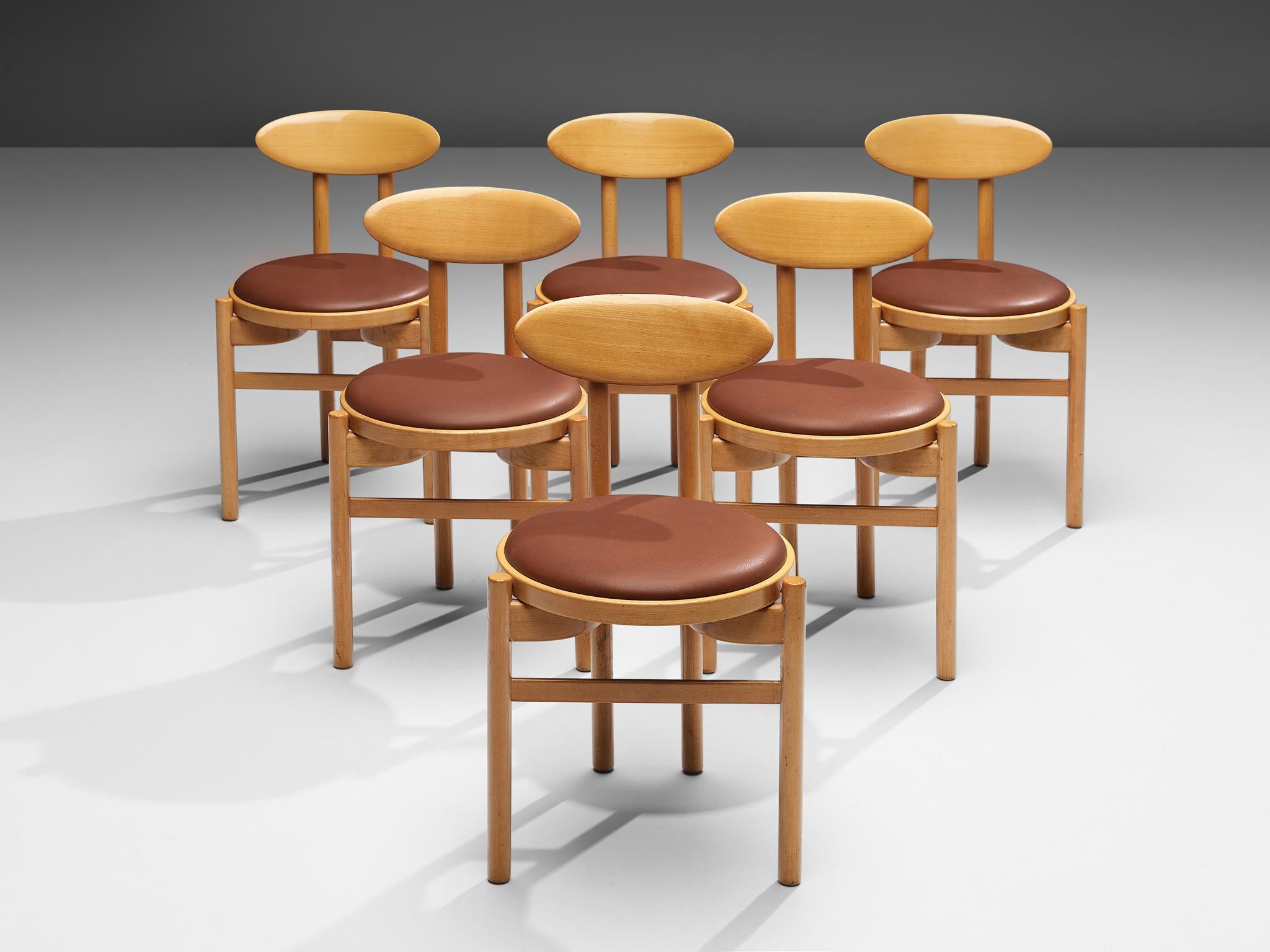 Pozzi, set of six dining chairs, stained beech, leatherette, Italy, 1970s

With their round seats and oval backrests these dining chairs by Italian manufacturer Pozzi have a dynamic, almost playful appearance. Two round legs in front and two paired