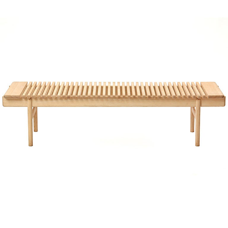 The PP589 bar bench in ash with slats resting on running rails. Each bar bench is made to order and takes between 16-24 weeks to produce. Available in oak or ash with soap or oil finish. Price varies with material and finish selection.

From the