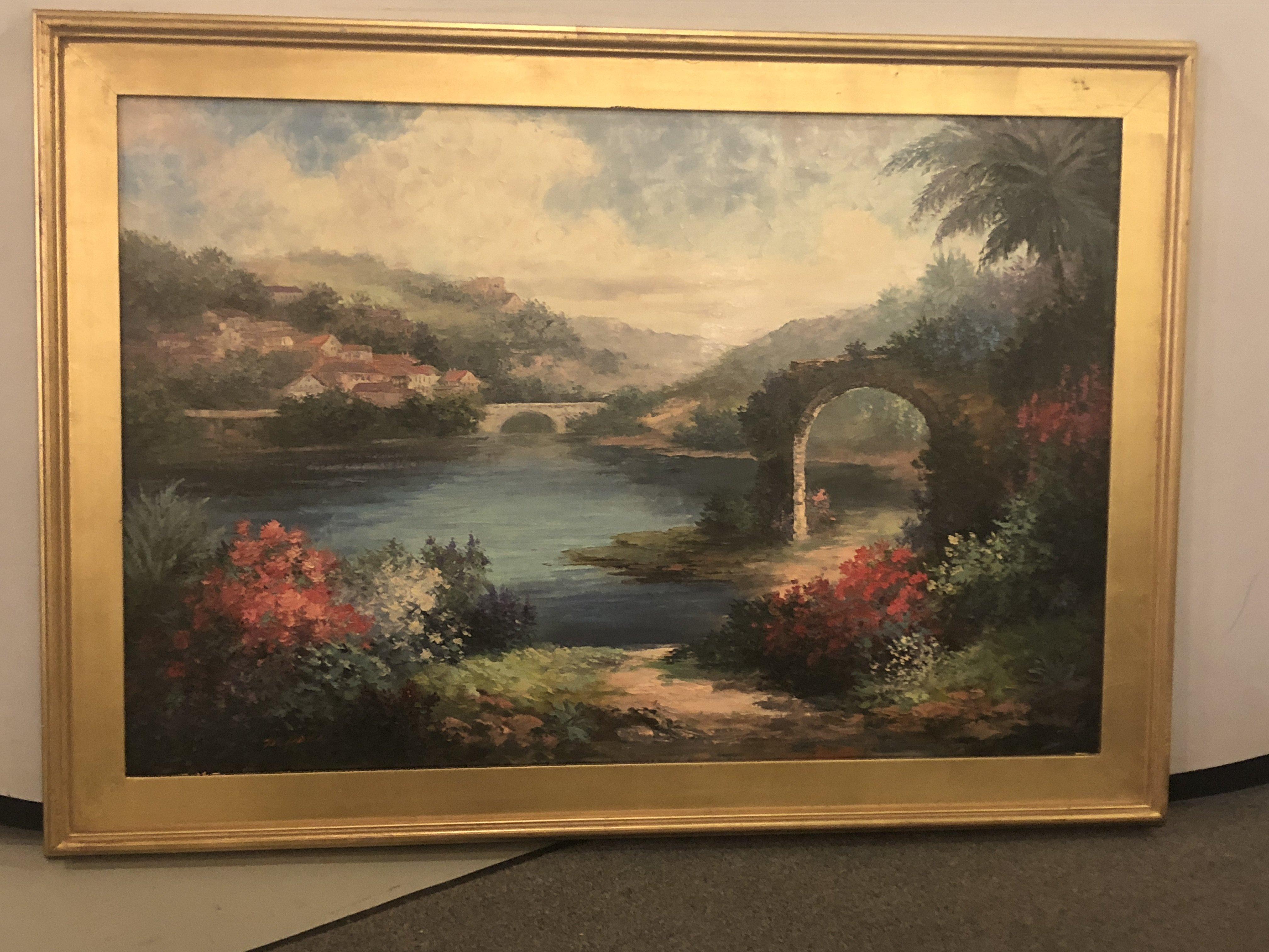 An elegant oil on canvas landscape painting featuring a lake view in a paradisiac environment. The painting is finely framed in custom giltwood frame. A wonderful addition to any living space or office. The painting is signed by artist, P. Paul