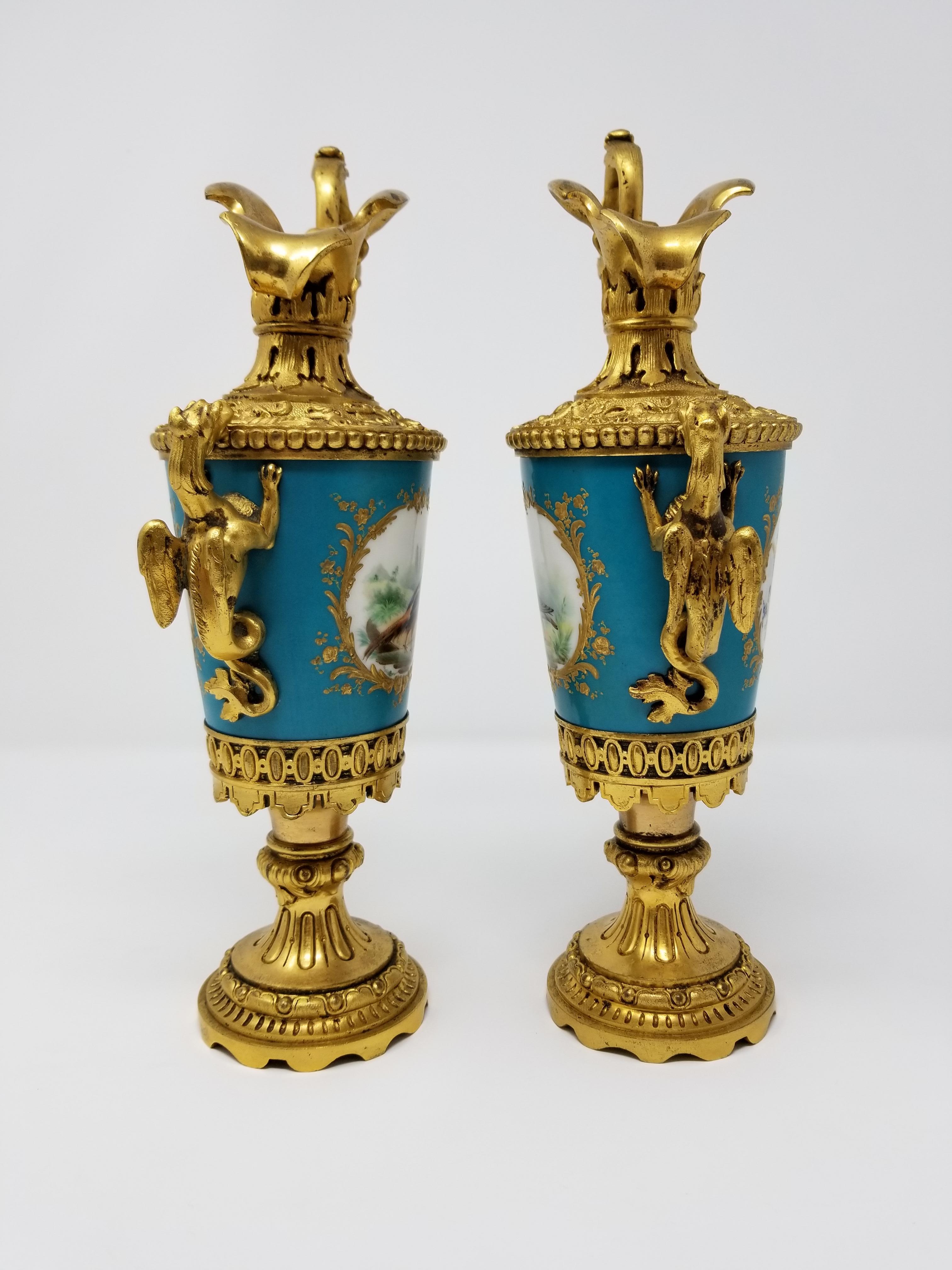 Louis XVI Pair of French Sèvres Porcelain Ormolu Mounted Ewers with Birds/Flowers/Dragons For Sale