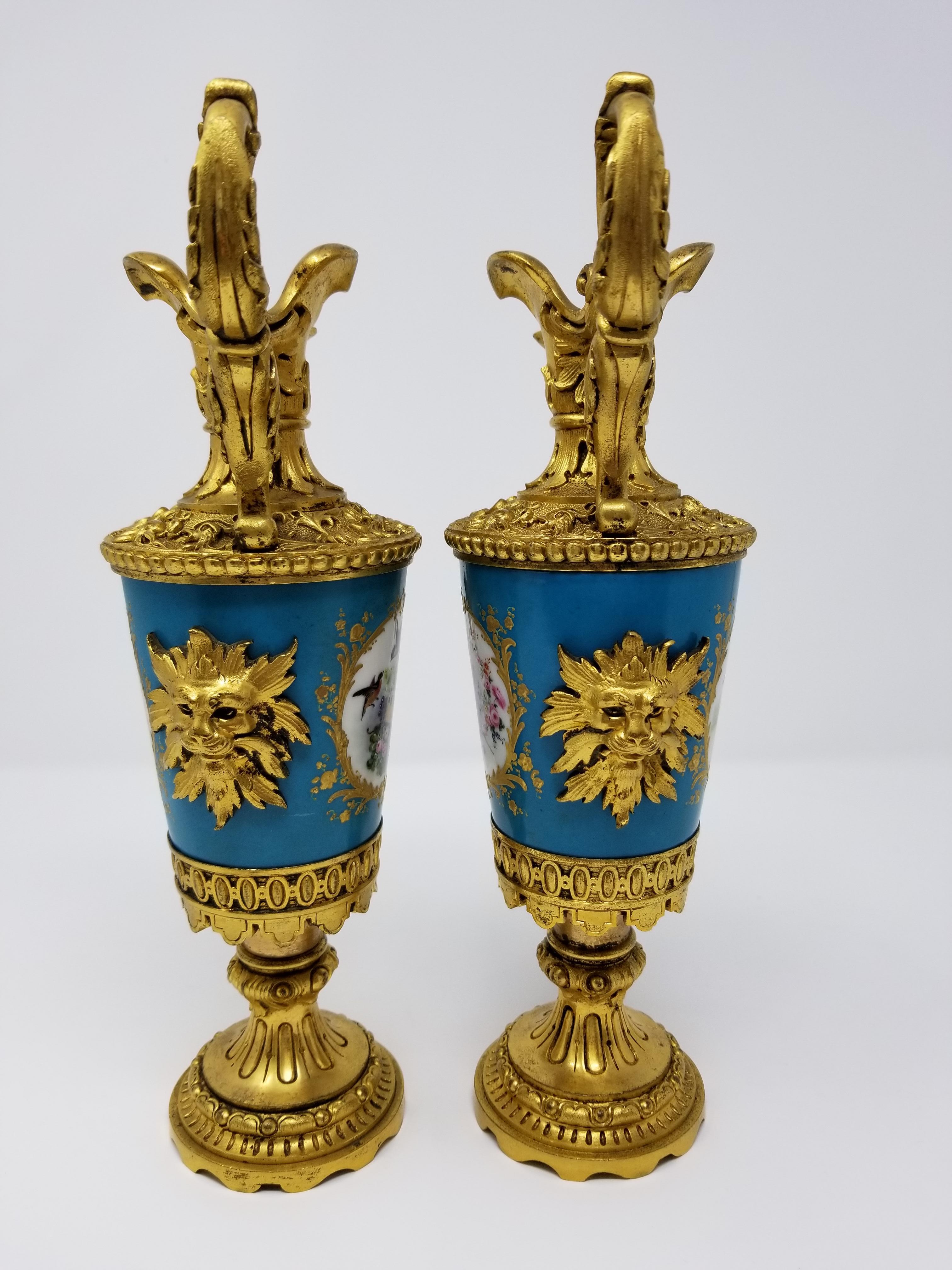 Hand-Painted Pair of French Sèvres Porcelain Ormolu Mounted Ewers with Birds/Flowers/Dragons For Sale