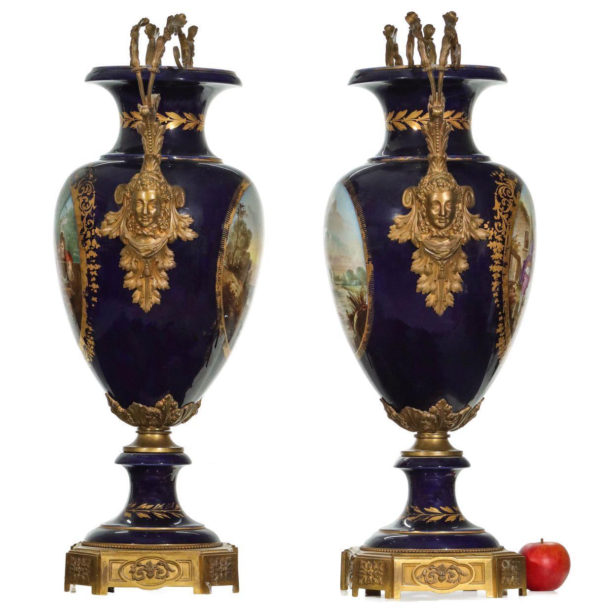 Pair of large 19 century french Louis XVI Sevres style cobalt blue ormolu mounted  porcelain vases with finely painted idyllic scenes of the countryside in the manner of Watteau, signed with monogram signature, TQuentin, and with well-cast gilt