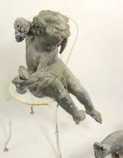 Pair of 19th Century Cast Lead Cupids from a Municipal Fountain