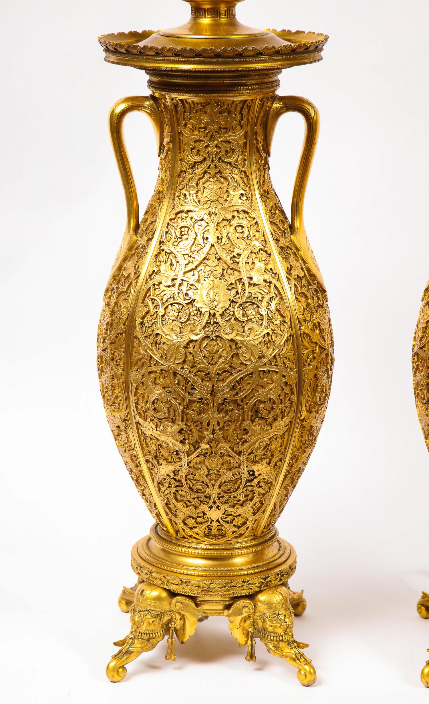 An important and monumental pair of very fine 19th century French Japonisme/Orientalist ormolu vases designed by Edouard Lièvre and Executed by Ferdinand Barbedienne. Each body with an oval shape, finely sculpted in a floral design, fringed by