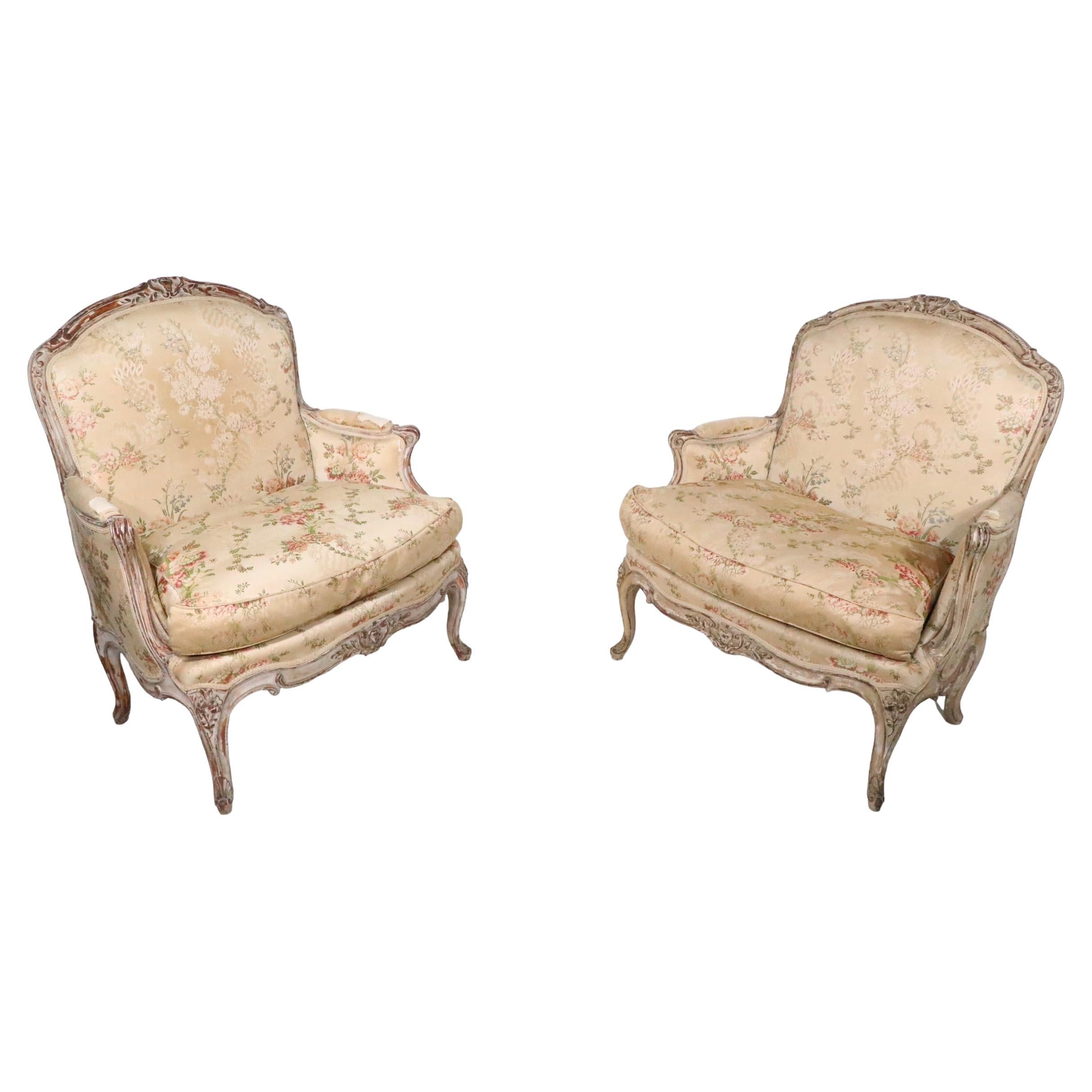 Voguish pair of French Beregeres, having hand carved wood frames, and upholstered seats and backs. The chairs are structurally sound and sturdy, the upholstery is as is, and will need to be replaced. We believe they are Louis XV, but we are not