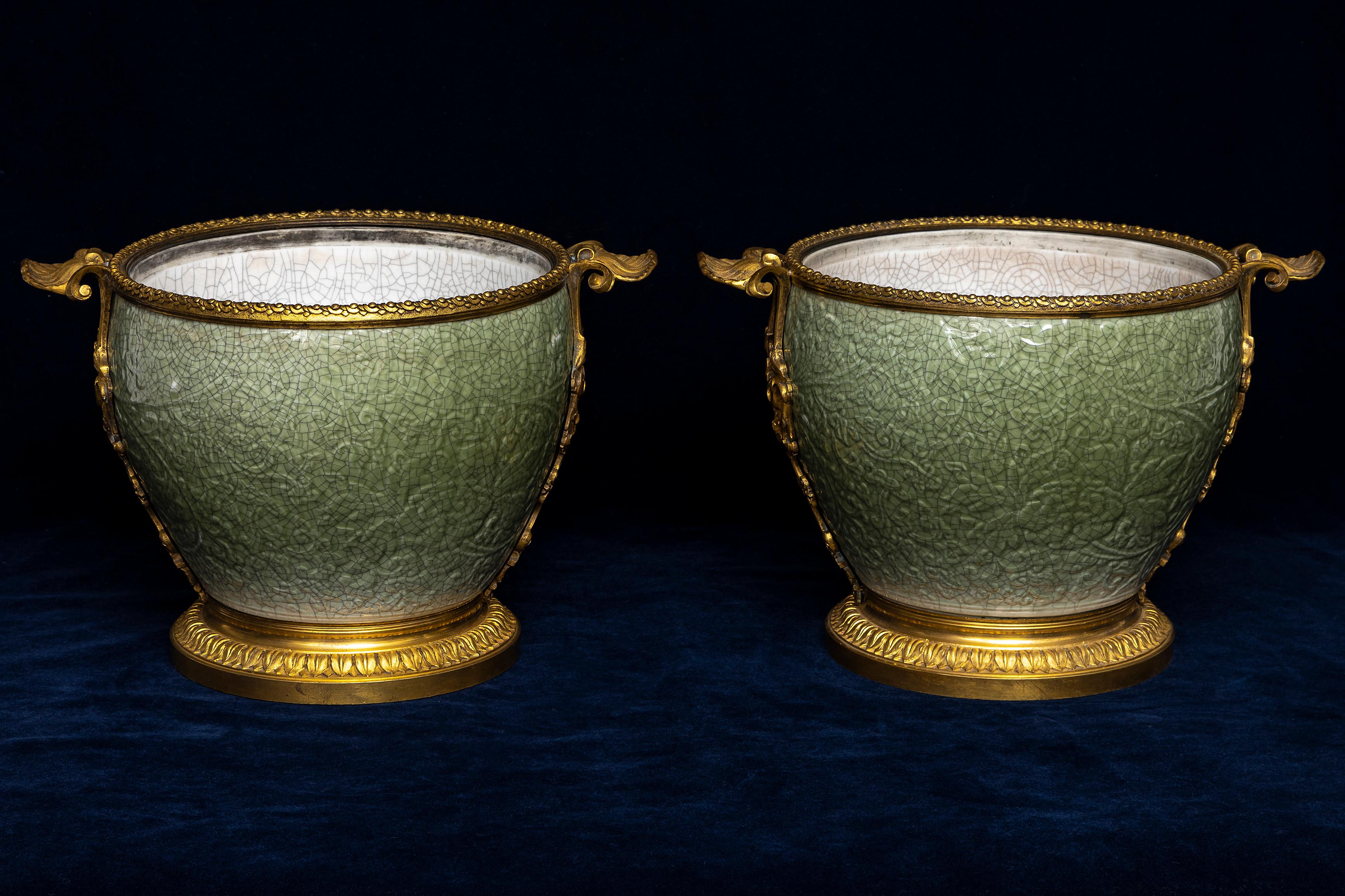 A Pair of Early 19th Century French Ormolu Mounted Regence Chinese Celadon Crackle Centerpieces/Bowls.  This pair of early 19th-century French ormolu-mounted centerpieces features finely executed Chinese celadon crackle porcelain bowls with
