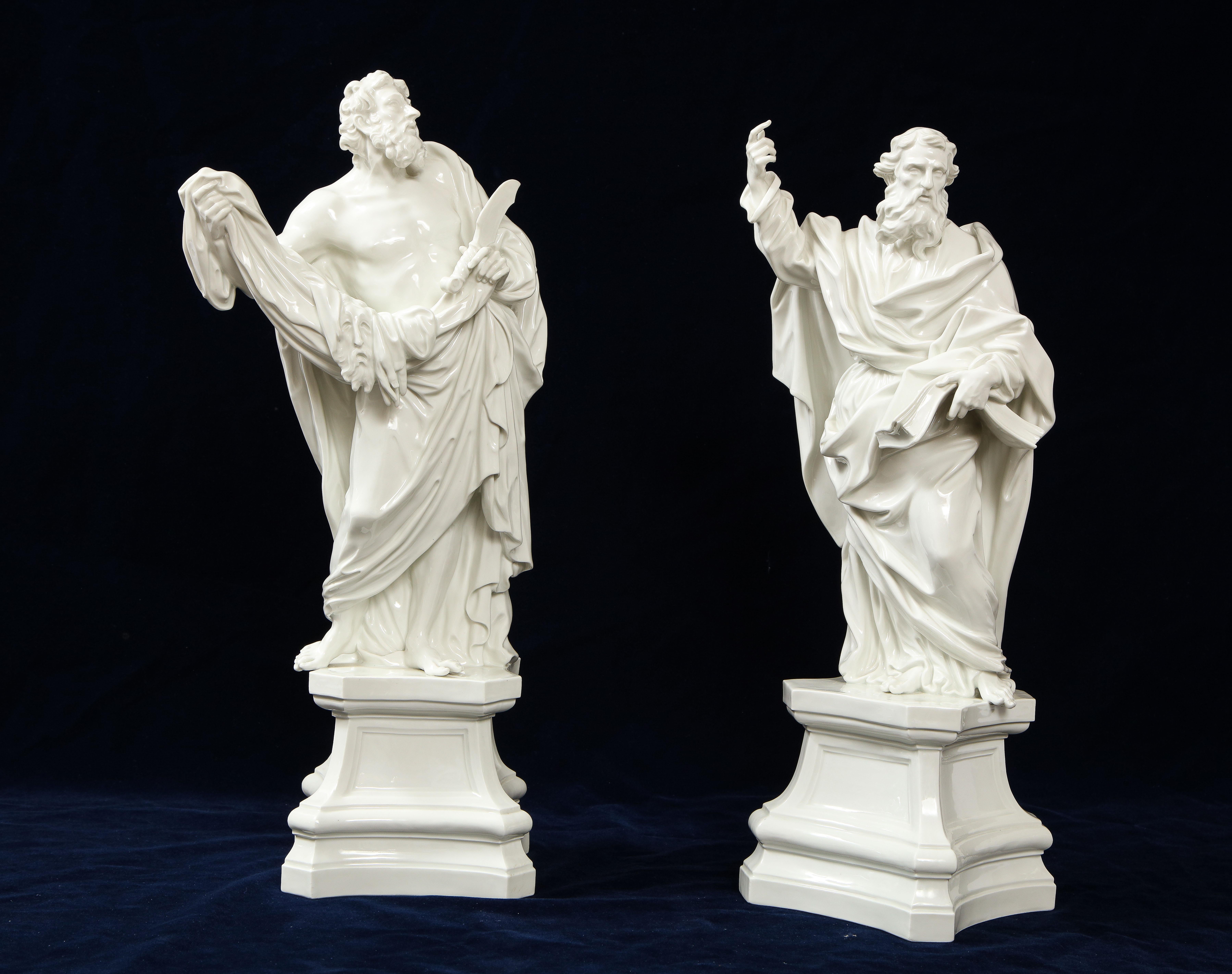 An Incredible and Quite Rare Pair of 19th Century Meissen Porcelain White Figures of St. James, Brother of St. John The Evangelist, and St. Paul, respectively. Each is beautifully hand-carved with very realistic detail. Both figures are perched a