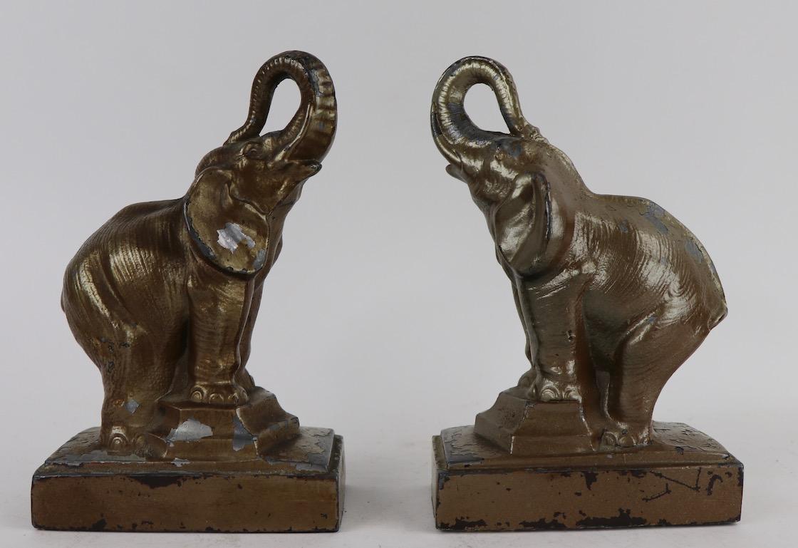Classic Art Deco elephant bookends, in the manner of FrankArt. Both are in good condition, both show cosmertic wear to finish normal and consistent with age. Dimensions in listing are per bookend.