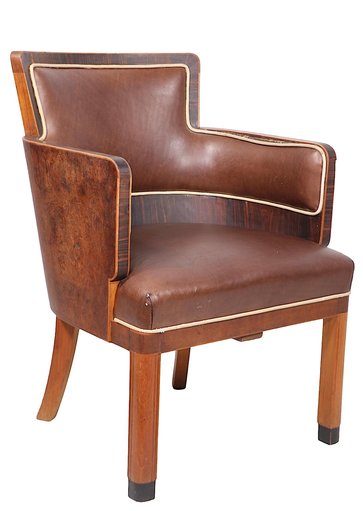 Exceptional pair of High Style Art Deco chairs, originally from the classic  Cunard cruise ship RMS Caronia c 1947,  and formerly property of noted NYC based  fashion designed and socialite Jackie Rogers.  
 The chairs feature a rich burl veneer