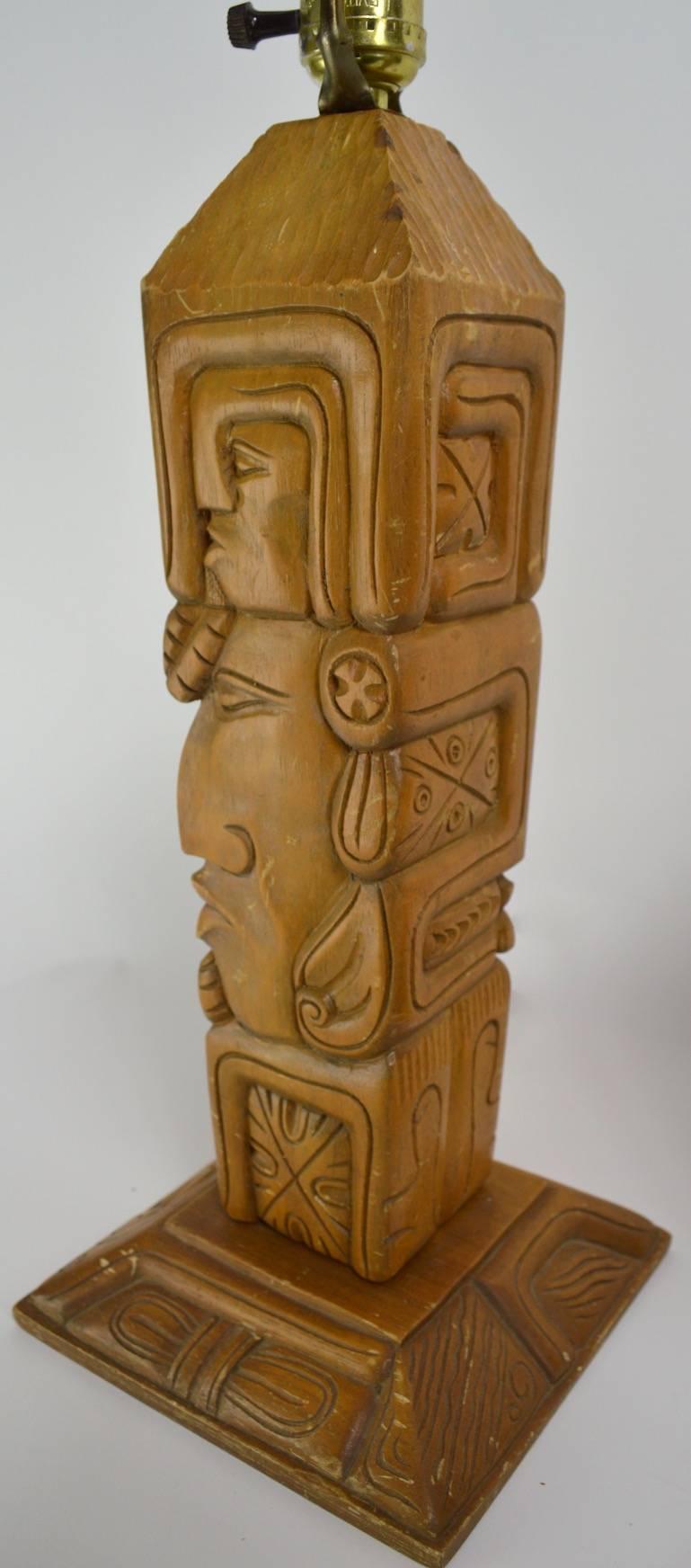 Pair of carved wood tiki, or Aztec style TOTEM lamps. Fun, funky and chic, working original condition, selling without shades, or harps. Dimension as follows:
18 in. H to top of socket x base 7 x 7 in. Priced and selling as a pair.
 