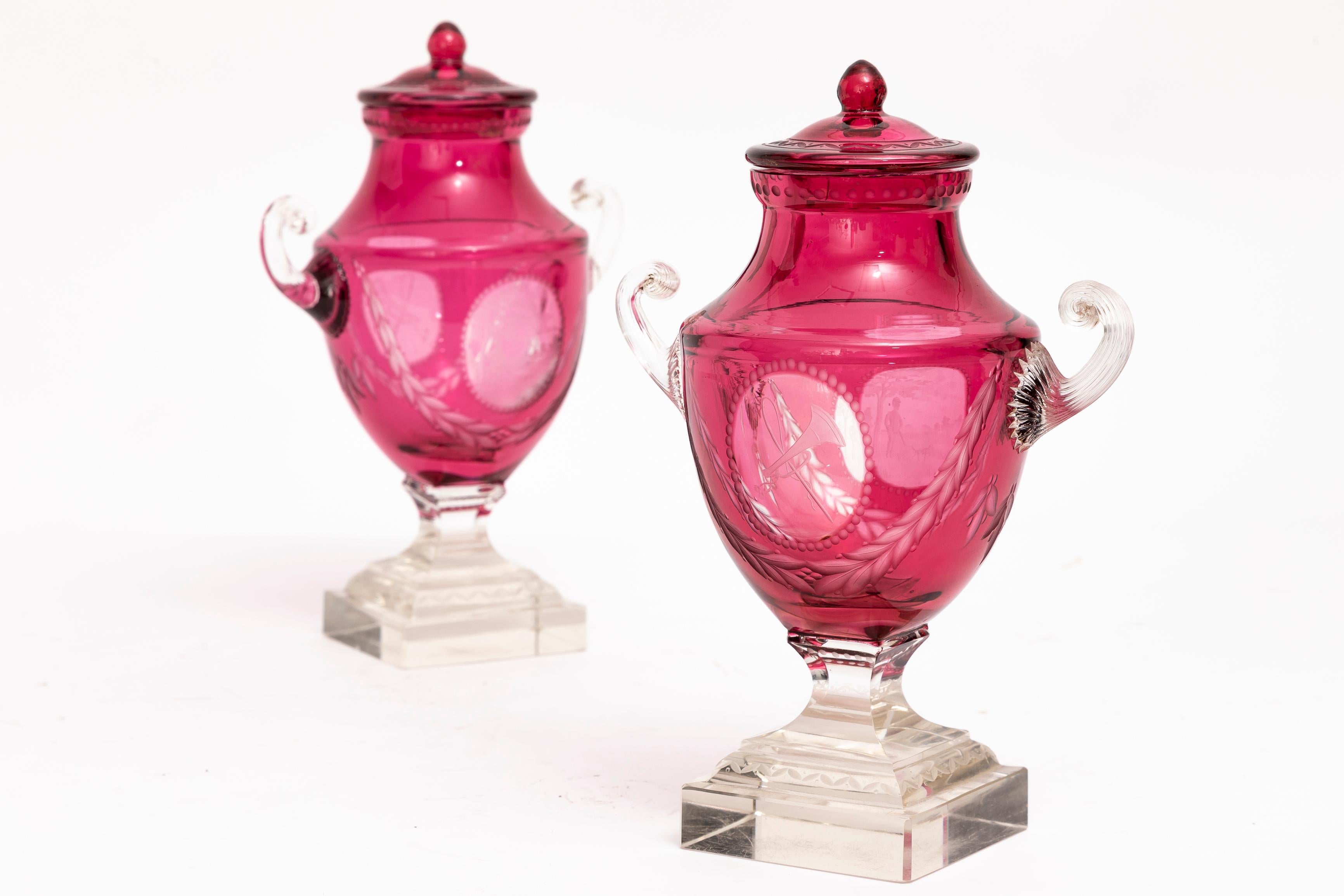 Hand-Carved Pr. Baccarat Red Cut-to-Clear Covered Vases w/ Central Cameo of Hunting Trophies For Sale