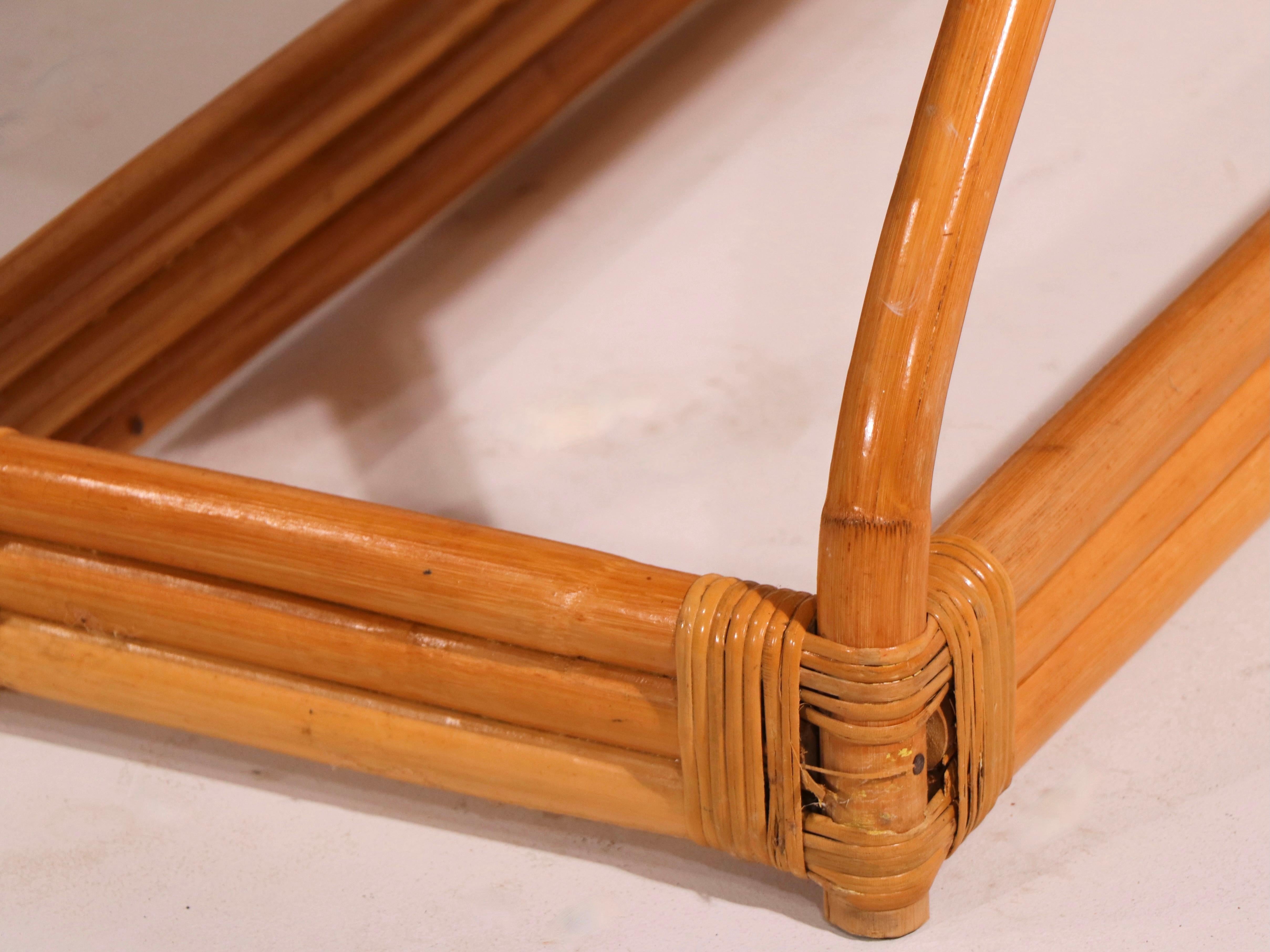 Stylish pair of two tier step end tables in bent bamboo and oak, each having a lower shelf (11 inch H) and an upper shelf (20 inch H). Both are in good, original condition, sturdy, clean and ready to use. Both show minor loss to the wrapping at the