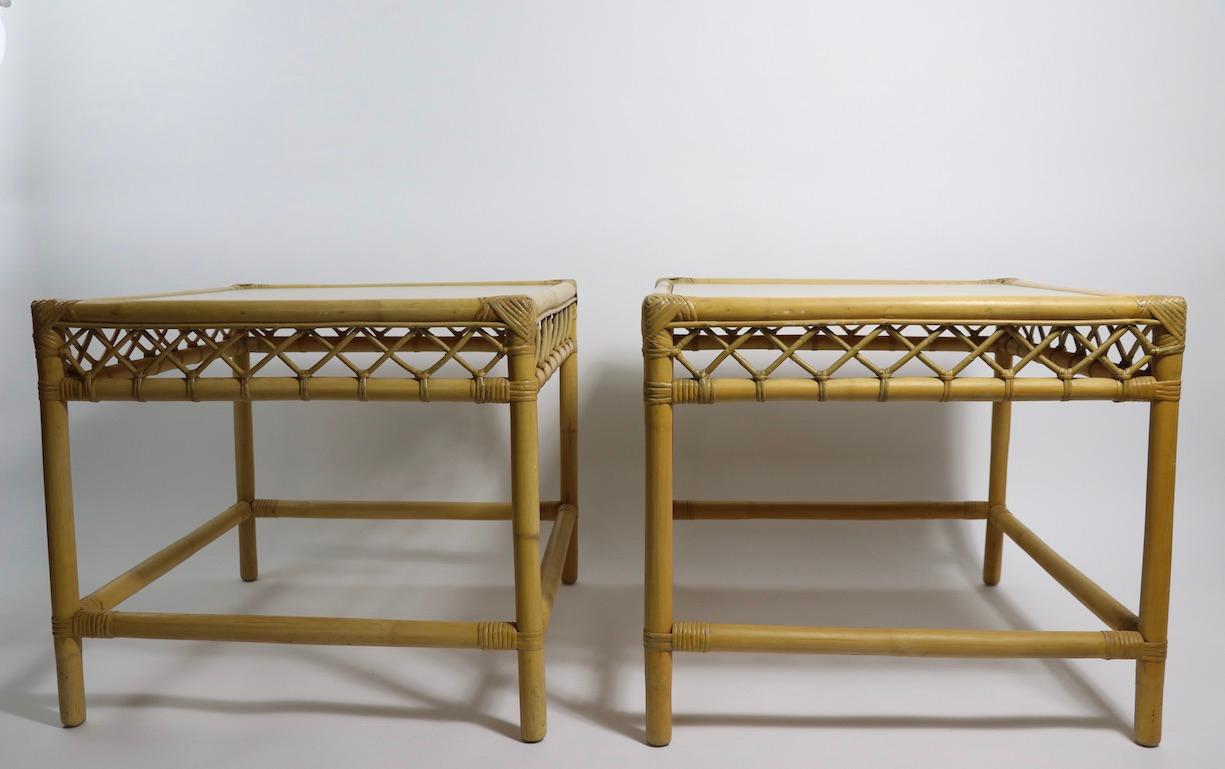 Stylish pair of side, or end tables, having bamboo frames and Formica tops. Both tables are in very good, clean original condition, one stand shows minor loss to wrapping at the corner, please see images.