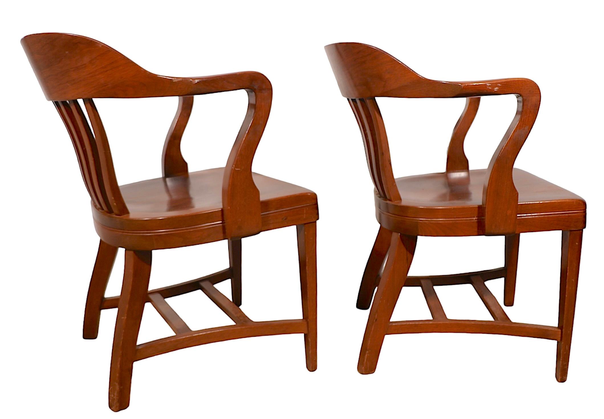 Exceptional pair of Bank of England, Yale Library, Jury chairs in excellent, clean,  ready to use condition. Unusual  to find these chairs in such good condition, especially in pairs. 
 Total H 31 x Arm H 28 x Seat H 18 x W 24 x D 18.5 inches.