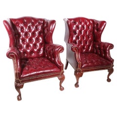 Pr. Burgundy Leather Ball and Claw Feet Chippendale Style Wingback Chairs