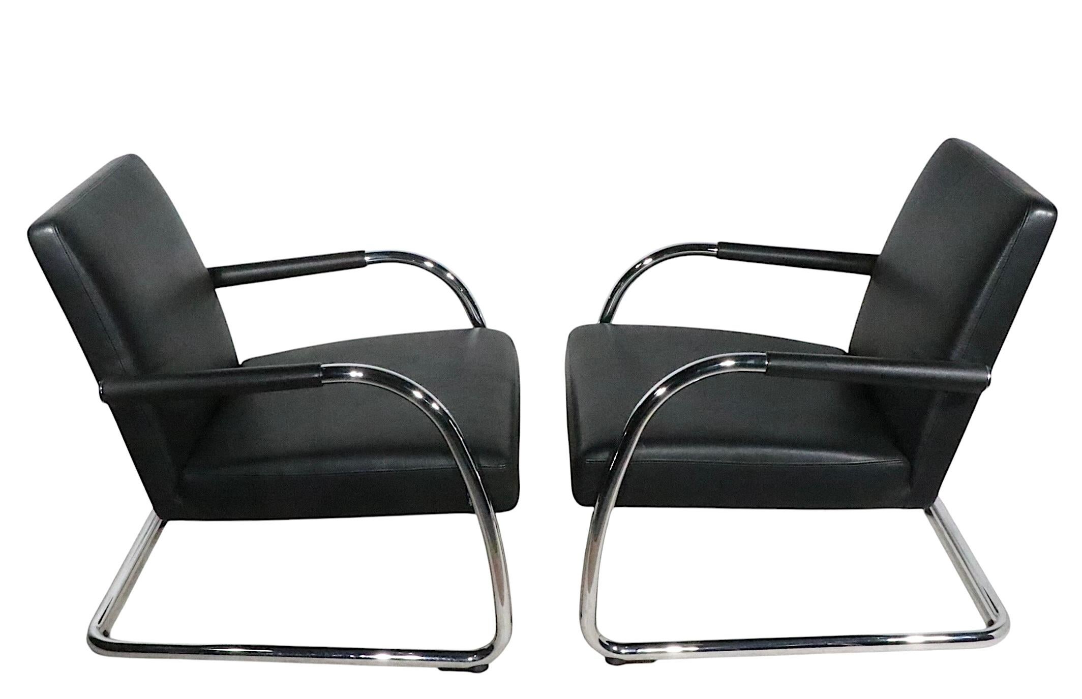 Chic pair of cantilevered lounge chairs, designed by Antonio Citterio, for Vitra. These chairs were produced in the early 21st century, with obvious reference to the earlier work of Marcel Breuer and related Bauhaus pieces. 
 Constructed of bright