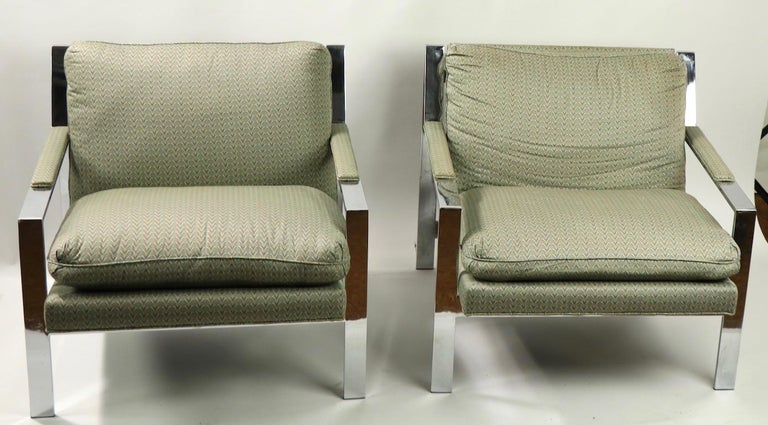 Stylish and chic pair of lounge chairs designed by Cy Mann.
Flat bar chrome frames support cushioned seat and backrest. Clean, original and ready to use condition. Measures: Total H 27 x ar. H 19 x seat H 18 inches. Offered and priced as a pair.