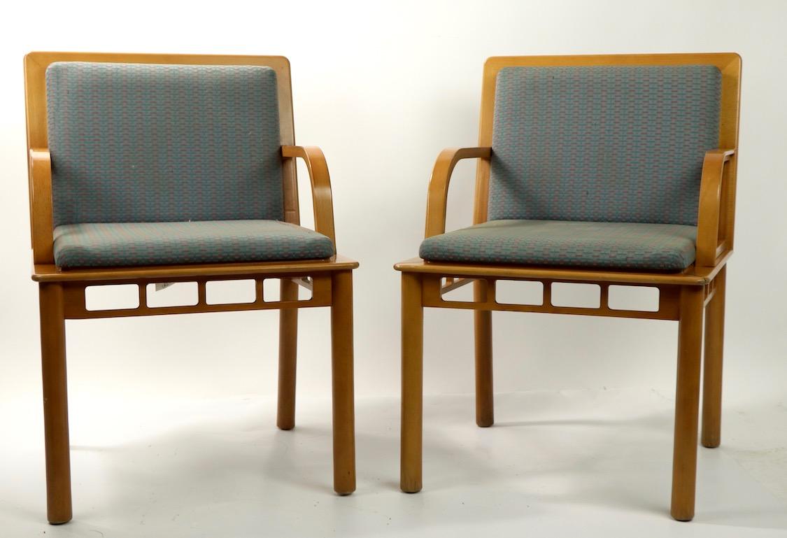Interesting and unusual pair of arm chairs marked Yugoslavia, distributed by Knoll. The chairs show the influences of a variety of modern style, from Renie Macintosh Vienna Secessionist, to Russian Constructivism, to Memphis design to Postmodern.