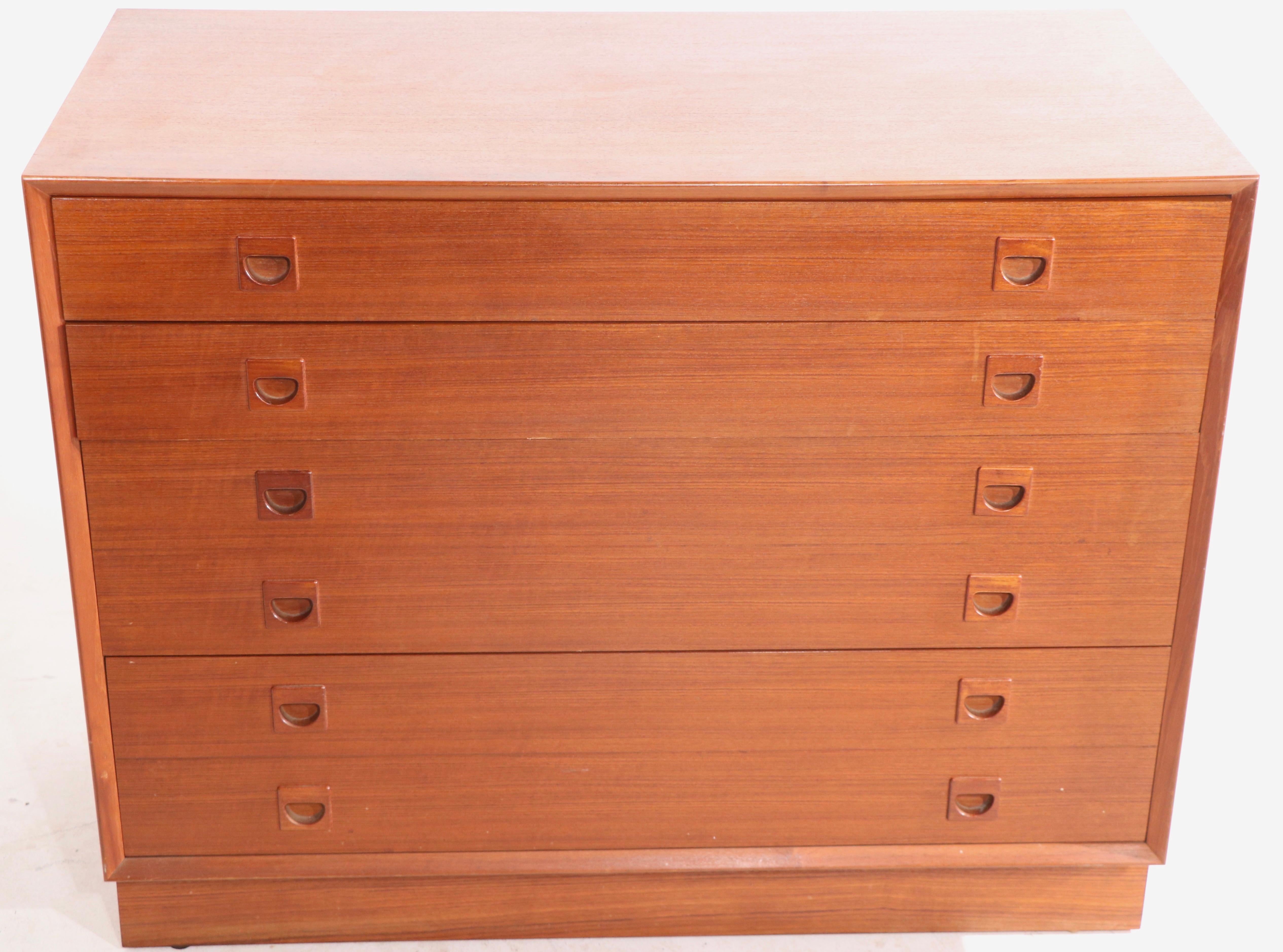Stylish architectural pair of Danish style dressers attributed to G - Plan of Great Britain. Both chests are in good original, vintage estate condition, showing only light cosmetic wear, normal and consistent with age. Hard to find matching pairs of