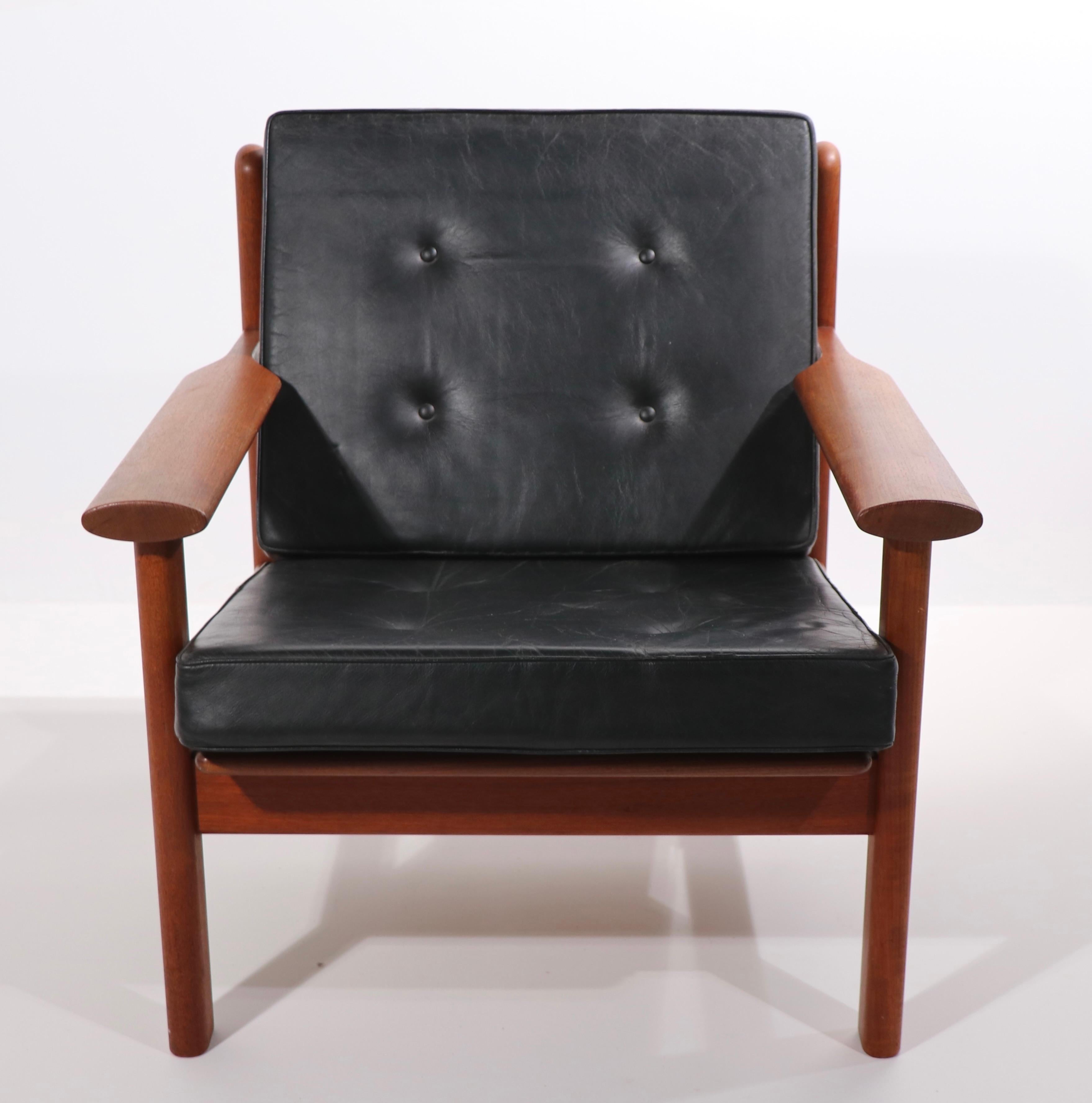 Exceptional pair of mid century Danish modern lounge chairs designed by Poull Volther for Frem Role circa 1950's. These chairs are in very fine, original condition, showing only minor cosmetic wear, normal and consistent with age. The frames are of