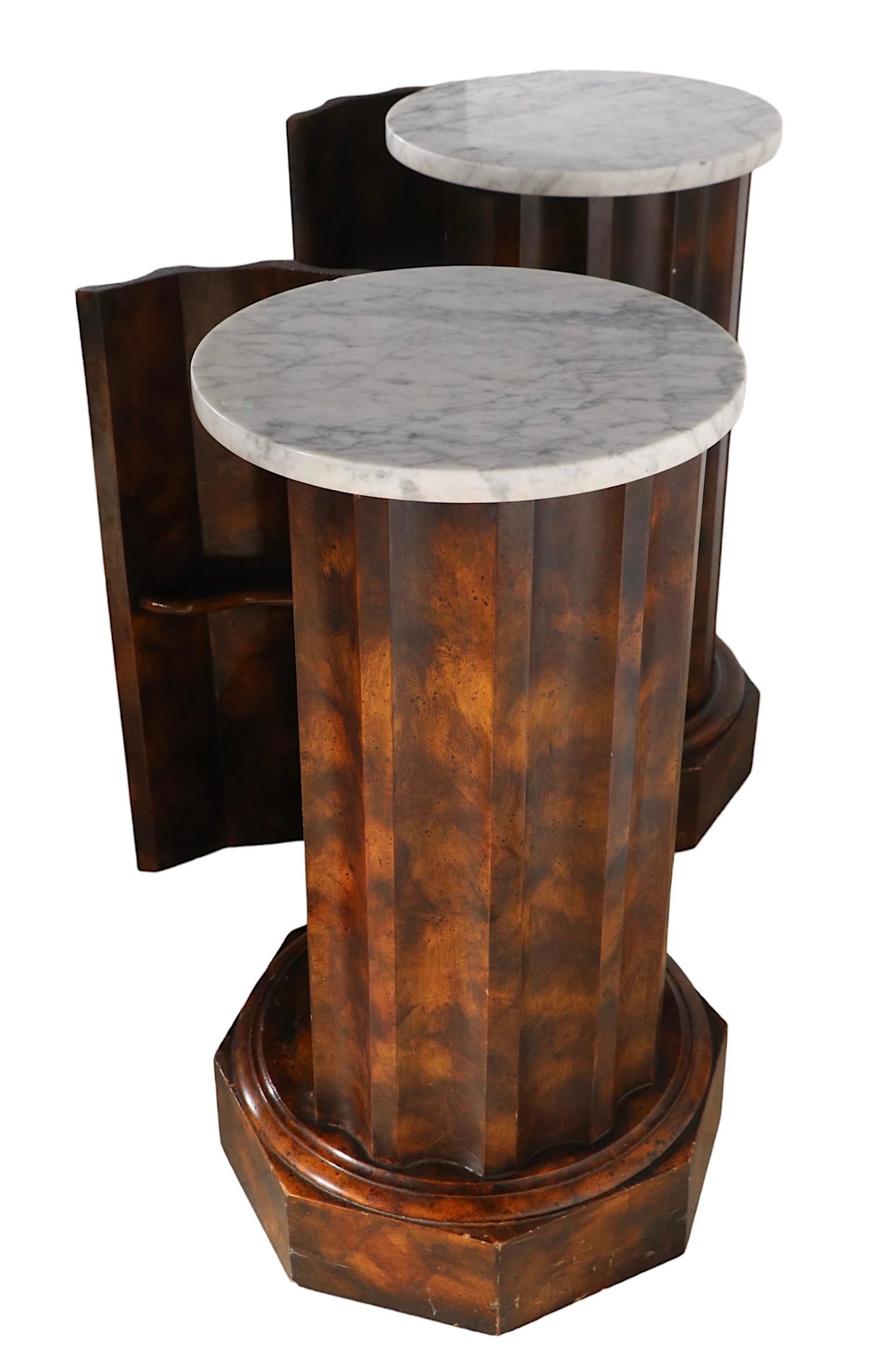 Pr.unusual half column pedestals, in faux tortoise shell finish, with marble tops. The columns open to reveal storage with an interior shelf. Both are structurally sound and sturdy, both show some cosmetic wear to the finish, normal and consistent
