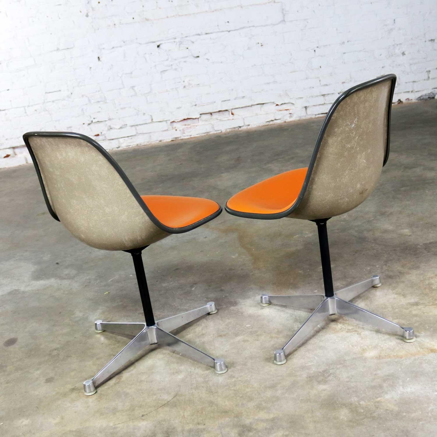 American Pair of  Eames PSC Orange Vinyl Upholstered Pivoting Side Shell Chairs