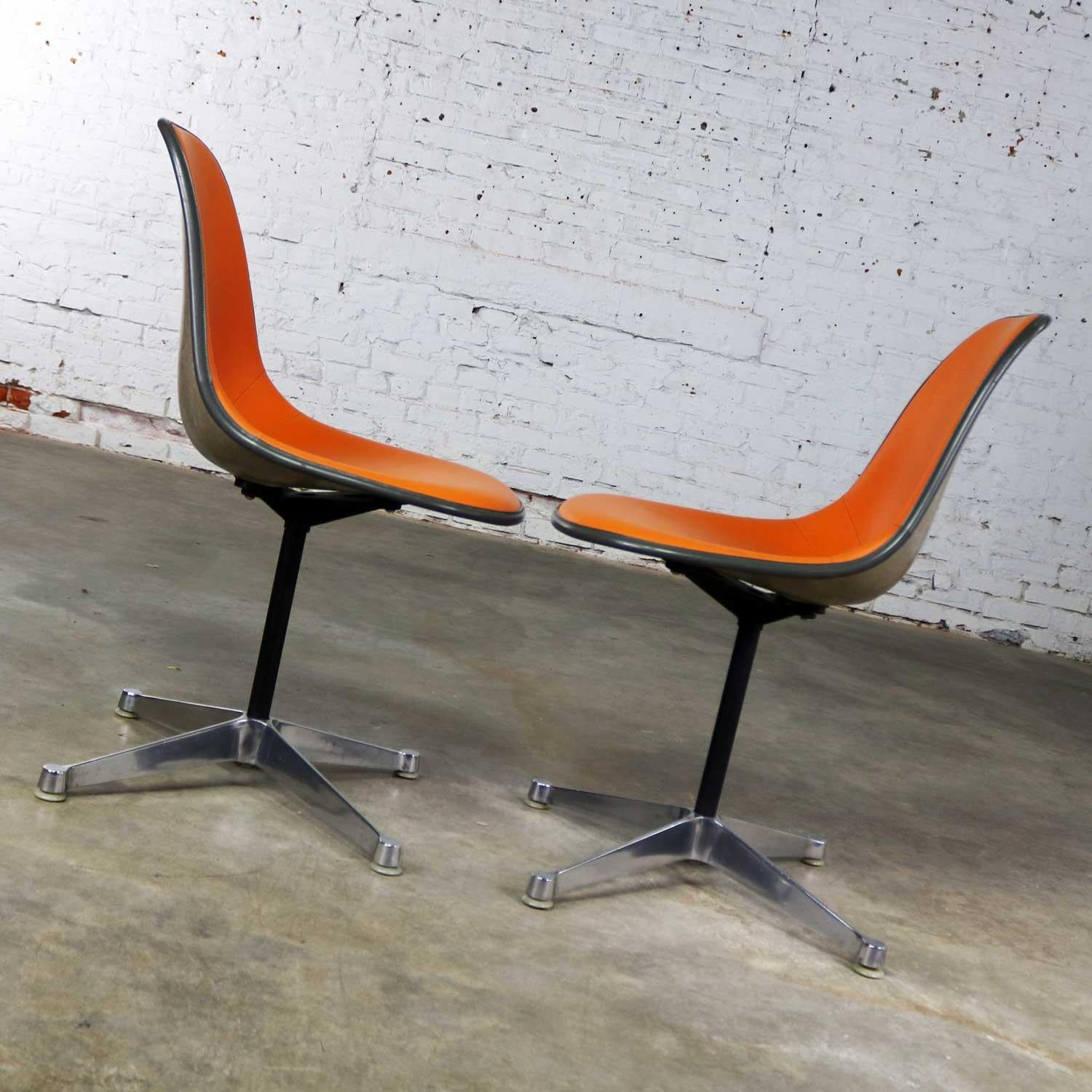 Pair of  Eames PSC Orange Vinyl Upholstered Pivoting Side Shell Chairs In Good Condition In Topeka, KS