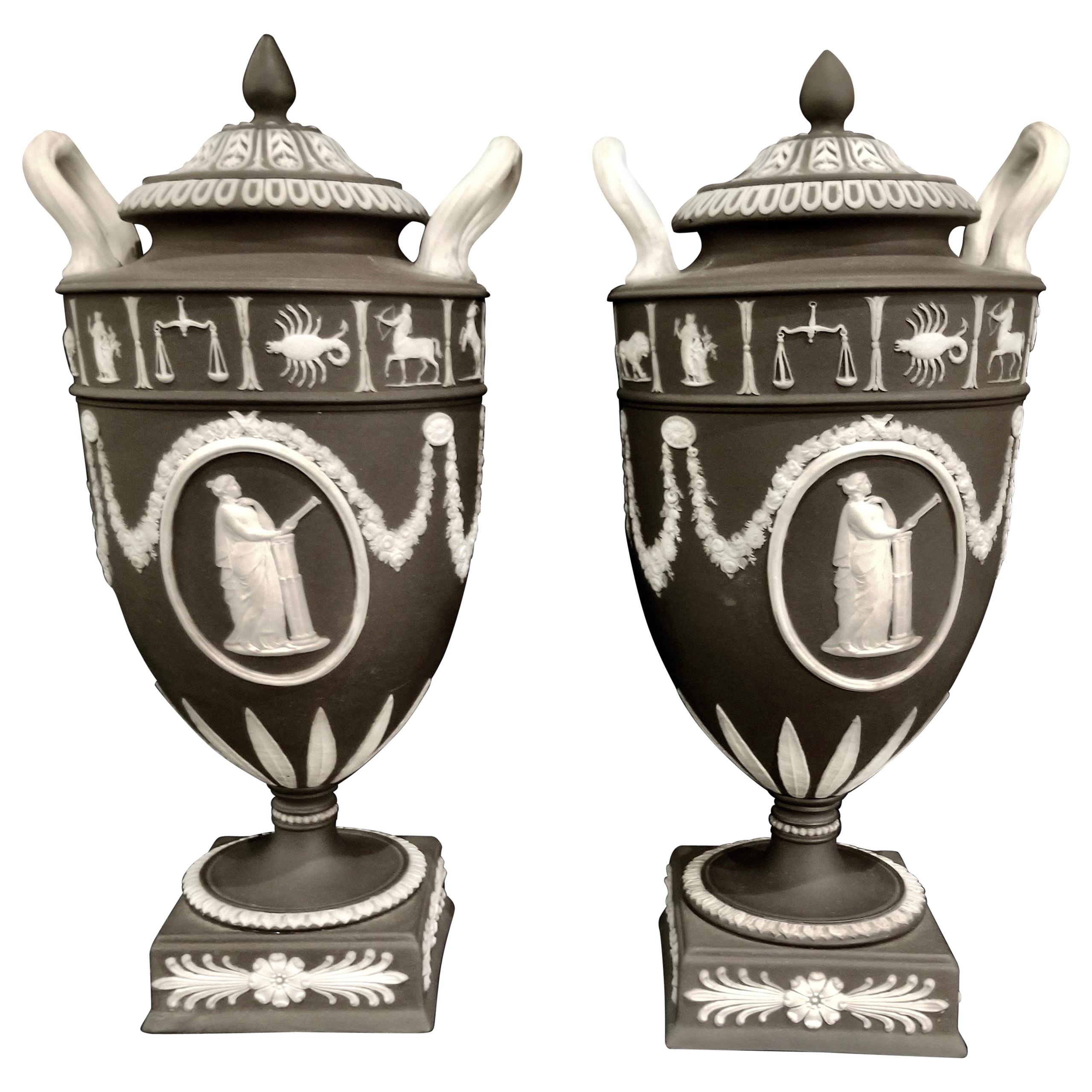 Pair of English Jasperware Lidded Black-Ground Wedgwood Vases with Zodiac Panels