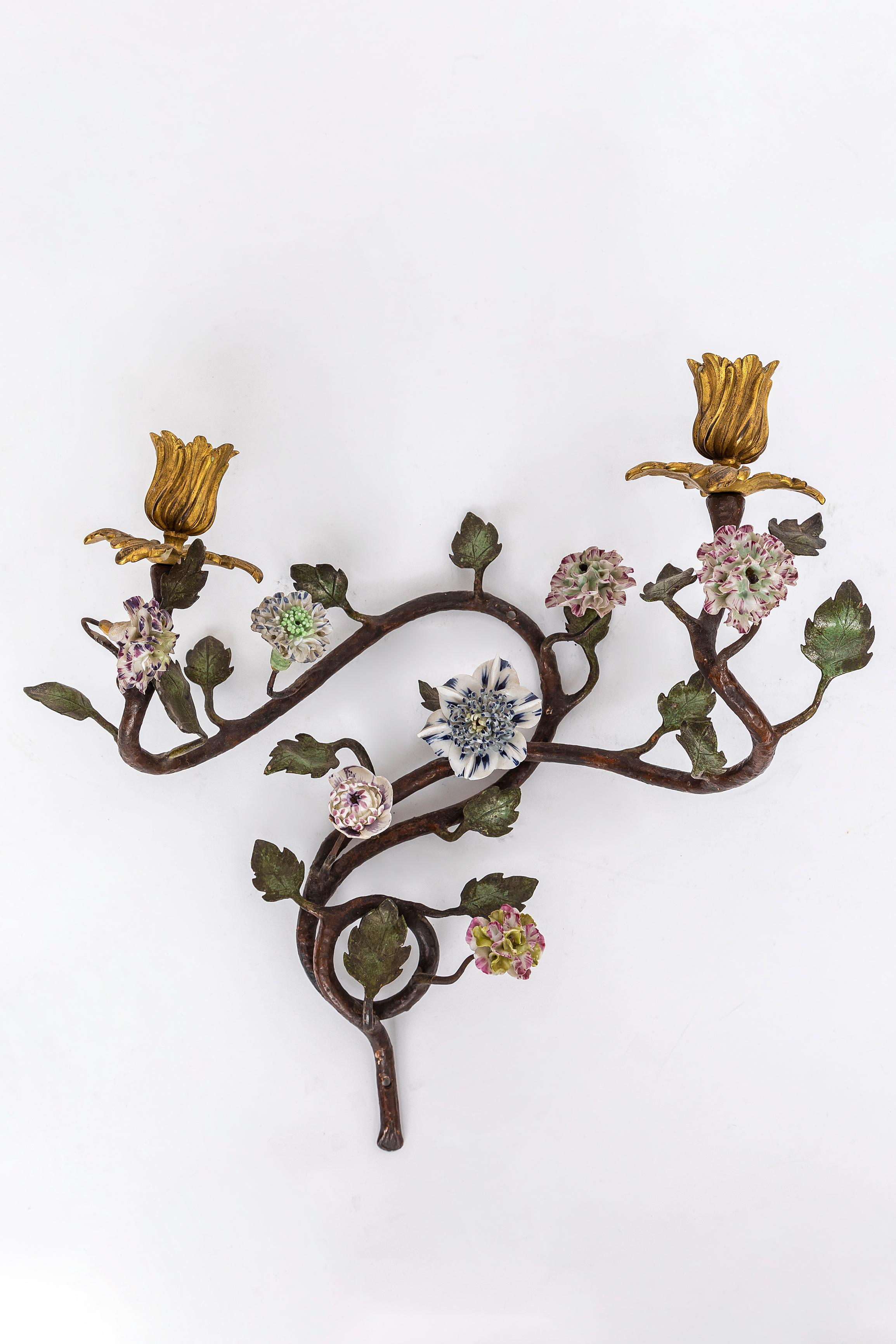 A Rare Pair of French 18th Century Mercury Gilt Dore Bronze, Patinated Bronze Leaves, and Painted Bronze Branch-Form Two-Arm Sconces with 18th Century Meissen Porcelain Flowers.  This pair of French 18th-century branch-form two-arm sconces features