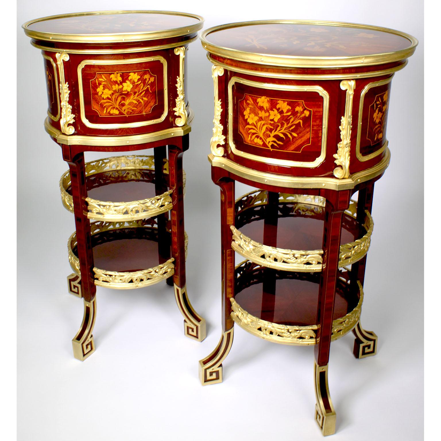 A Fine Pair of French 19th-20th Century Louis XV Style Ormolu Mounted Mahogany and Stained Fruitwood Marquetry Circular End or Side Tables en Chiffoniere, Joseph Emmanuel Zwiener - Jansen Successeur. Each table with a circular top inlaid with a