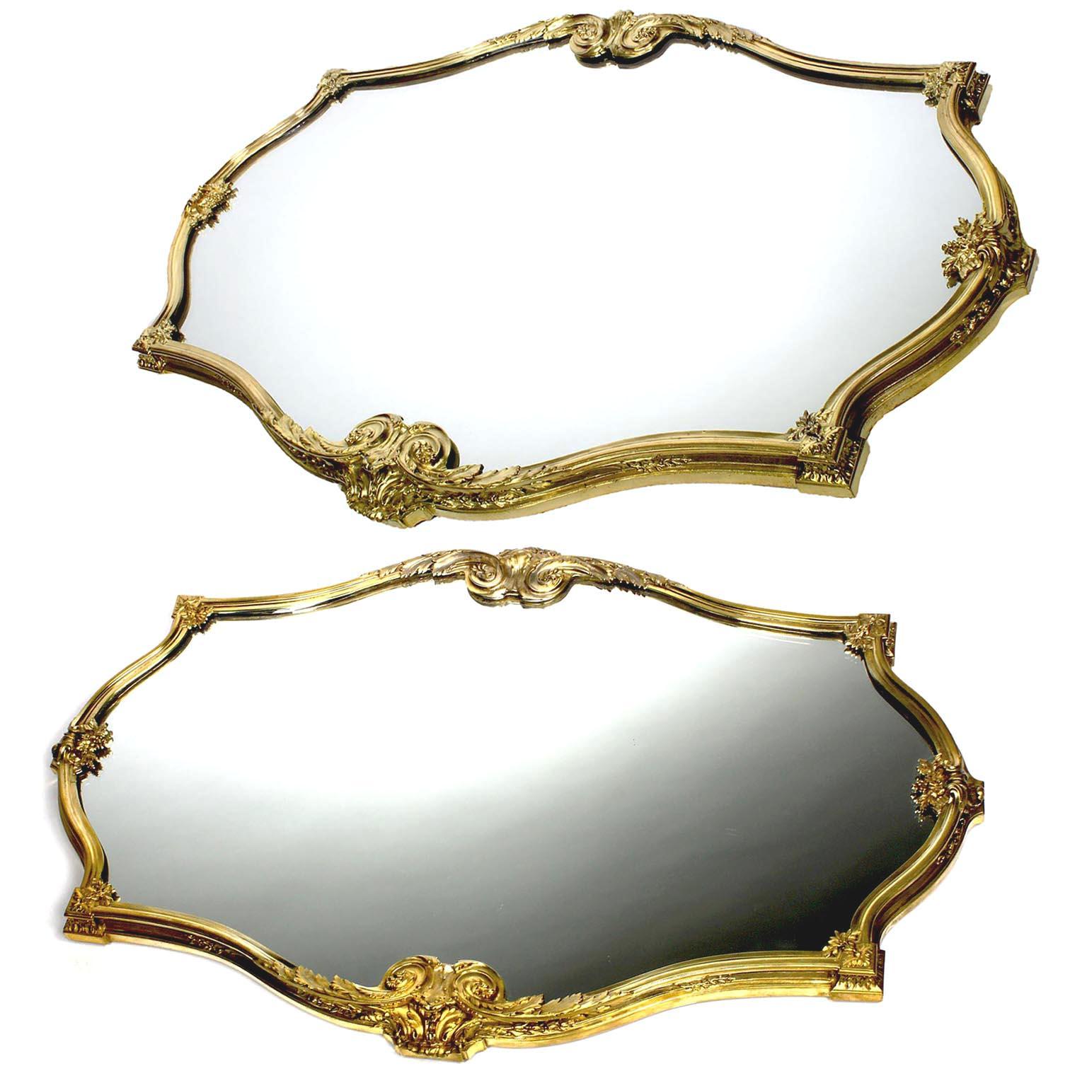 A fine pair of French 19th-20th century Louis XV style gilt-bronze surtout-de-Table plateau centerpieces by the Parsian Orfèvre Paul Canaux et Cie. The ovoid shaped gilt-bronze bodies with floral, acanthus and leaves design fitted with a mirror