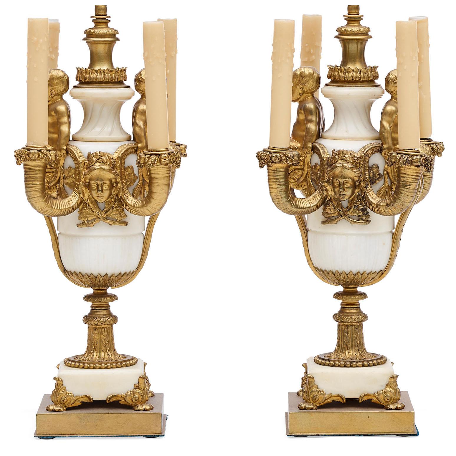 A Very Fine Pair of French 19th Century Louis XV Style White Marble and Gilt-Bronze Mounted Four-Light figural Candelabra (Now mounted as lamps), attributed to Henri Picard (French, 1831-1864). The ovoid white marble bodies, each supporting a pair