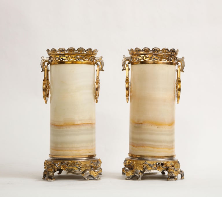 A Marvelous Pair of 19th Century Antique French Chinoiserie Silvered and Dore Bronze Mounted Honey Alabaster Vases Turned to Lamps, in the style of Edouard Lievre. Each is beautifully hand-carved from natural honey alabaster stone. The top mounts