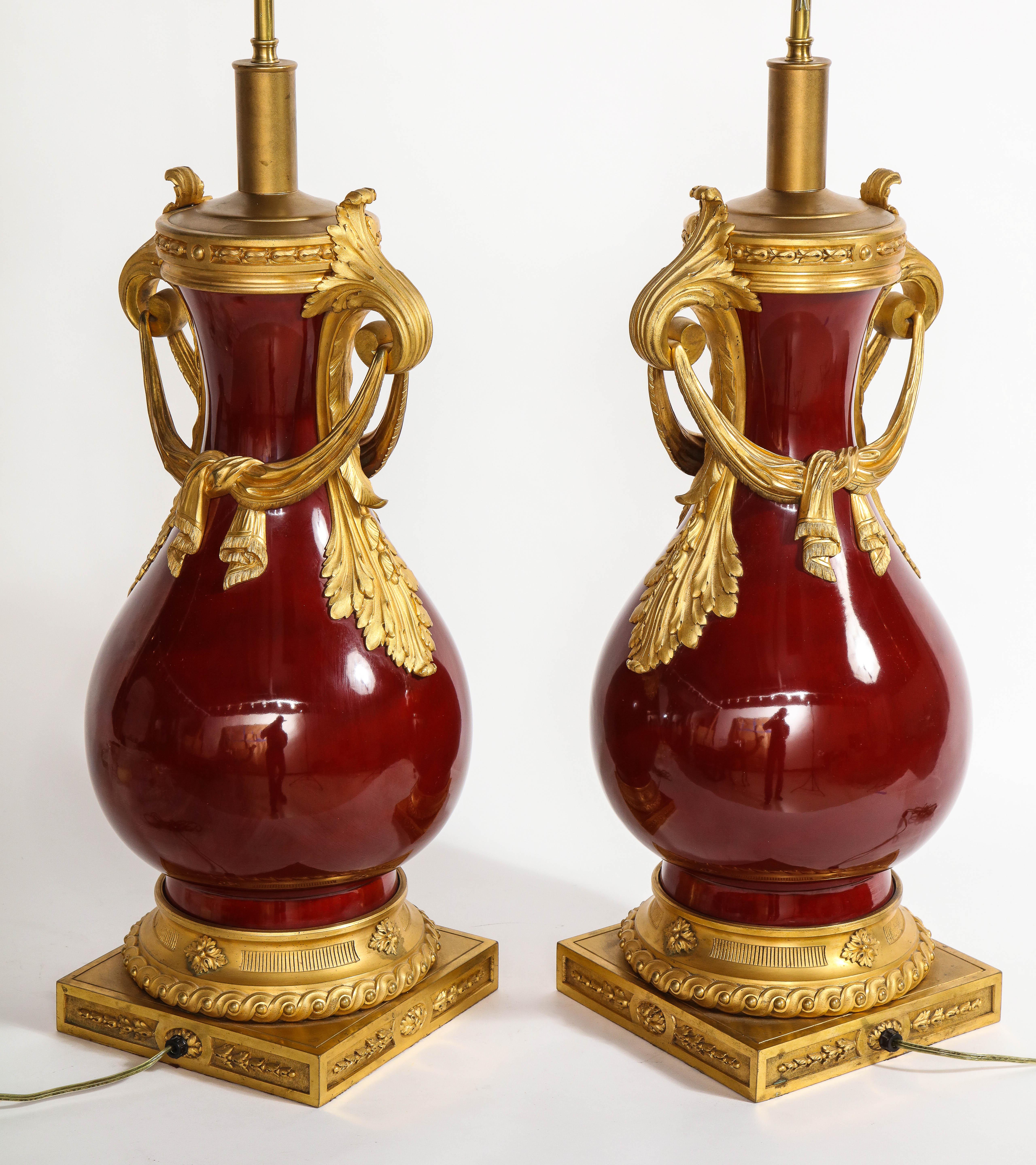 French Louis XVI Style Dore Bronze & Chinese Sang De Boeuf Porcelain Lamps, Pair In Good Condition For Sale In New York, NY
