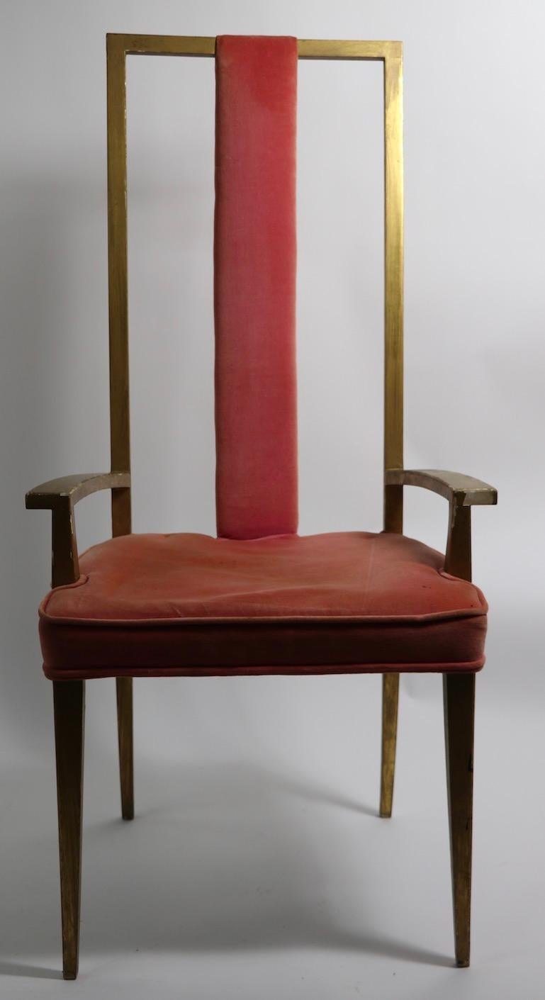 Pair of stylish architectural high back armchairs, having painted gold wood frames, and pink velvet fabric upholstery ( worn ). Great lines, elegant modern style in the manner of Tommi Parzinger. Both chairs show wear to wood finish, and have been