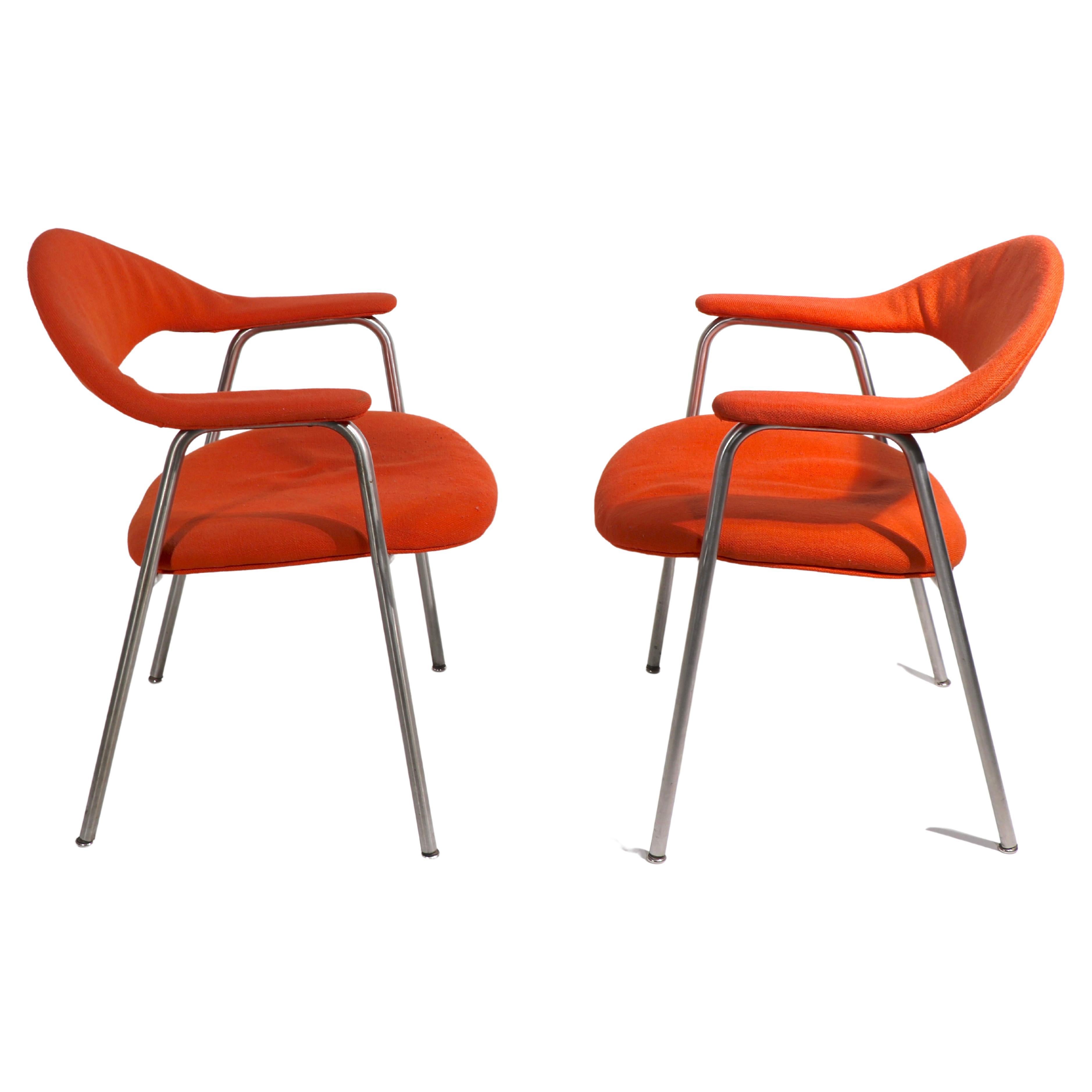 Chic and sophisticated pair of office, dining, occasional chairs made by Marble Imperial Furniture, design attributed to Jens Risom. The chairs have brushed steel frames, and orange tweed fabric, upholstery shows wear and will need to be replaced,