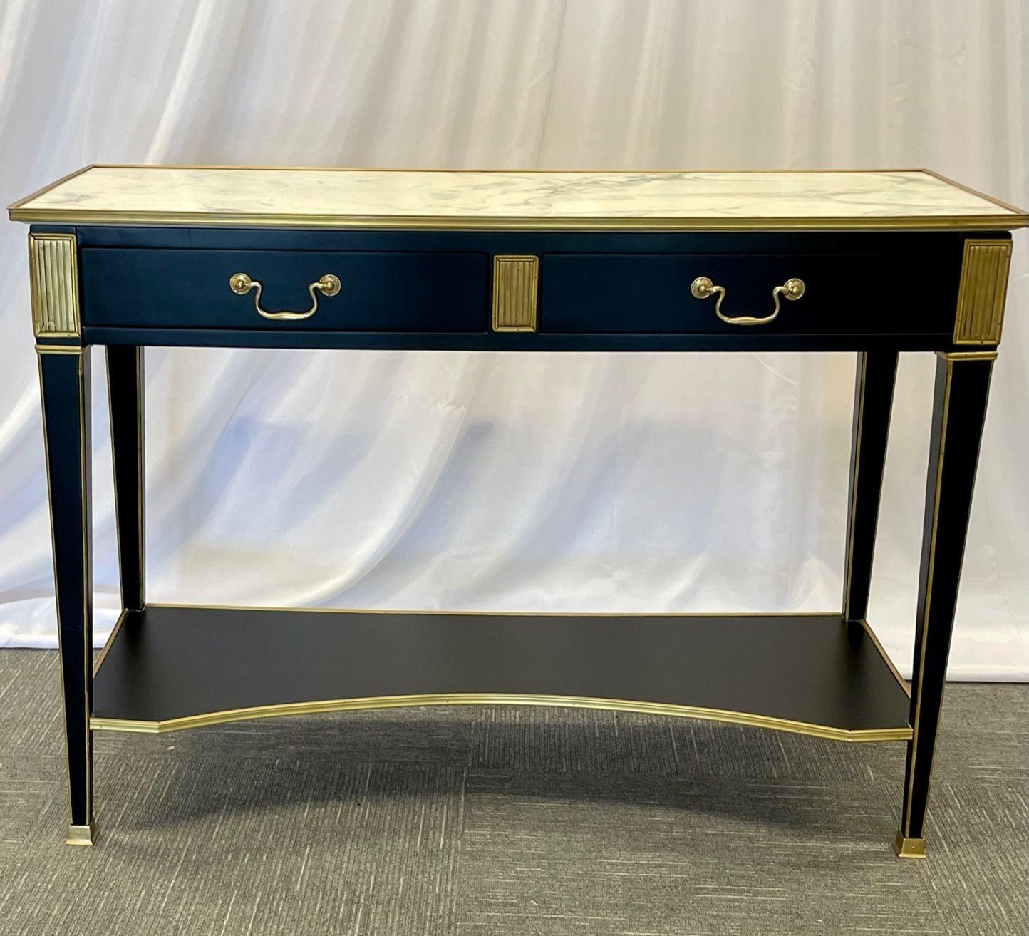 Pair of Hollywood Regency Neoclassical Ebony Console or sofa tables, Manner of Maison Jansen
 
Pair of Hollywood Regency neoclassical ebony console or sofa tables in the manner of Maison Jansen. A stunning sleek and stylish pair of console tables